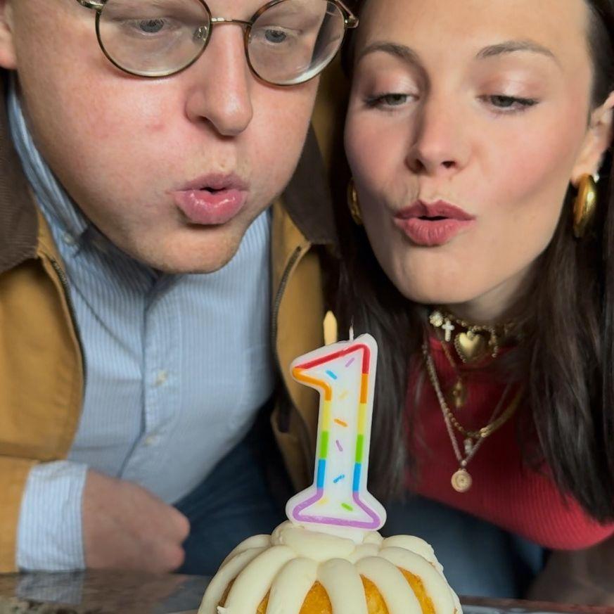May 2025: Our 1st anniversary! Blowing out the candles on year 1!