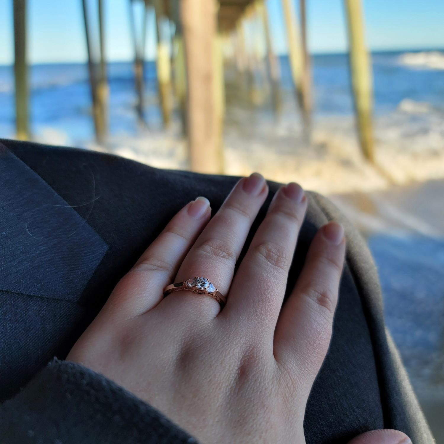 A few moments after we got engaged right before our feet and legs got soaked by a wave.