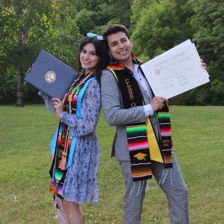 At our graduation party with our diplomas