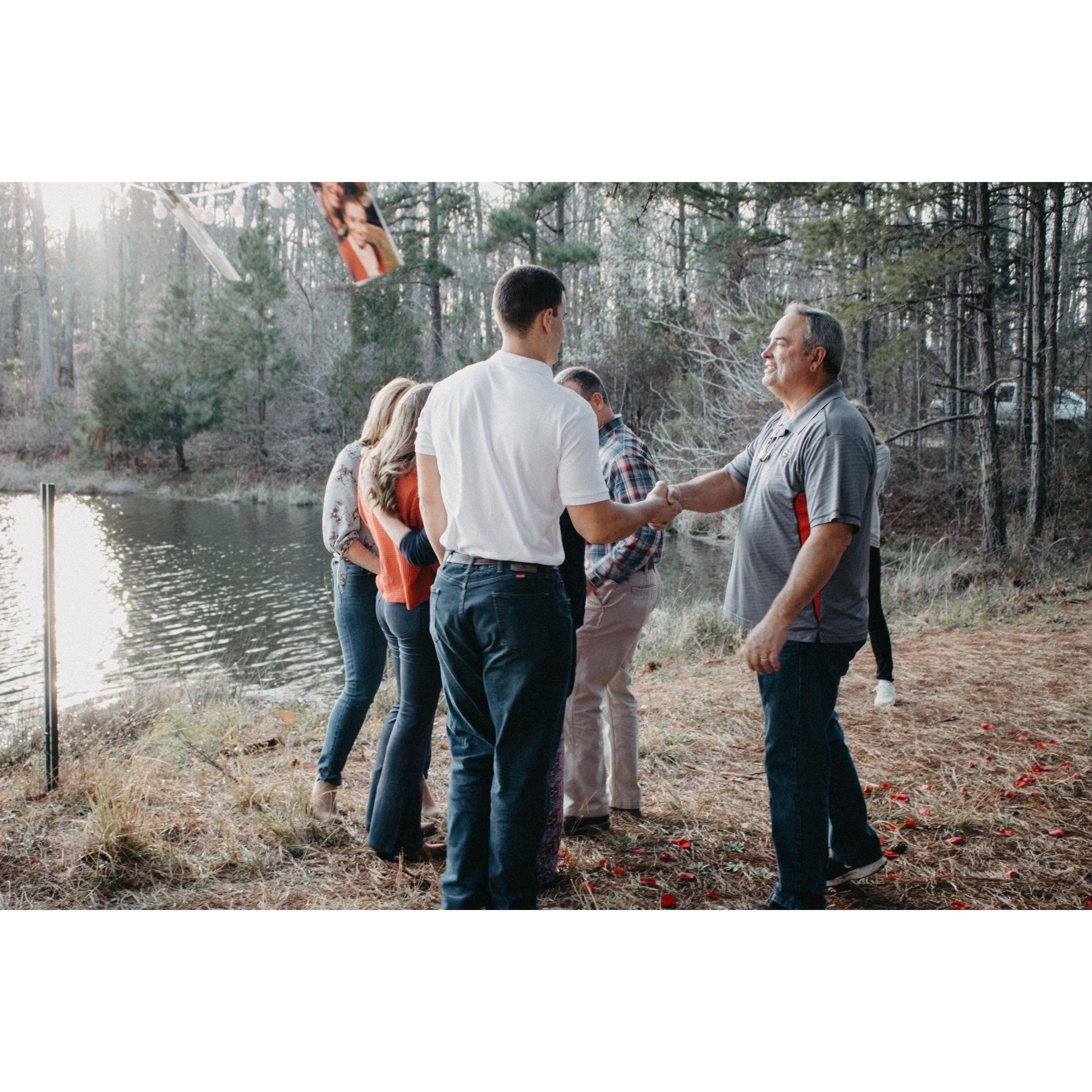 Handshake of approval from Charlie's dad