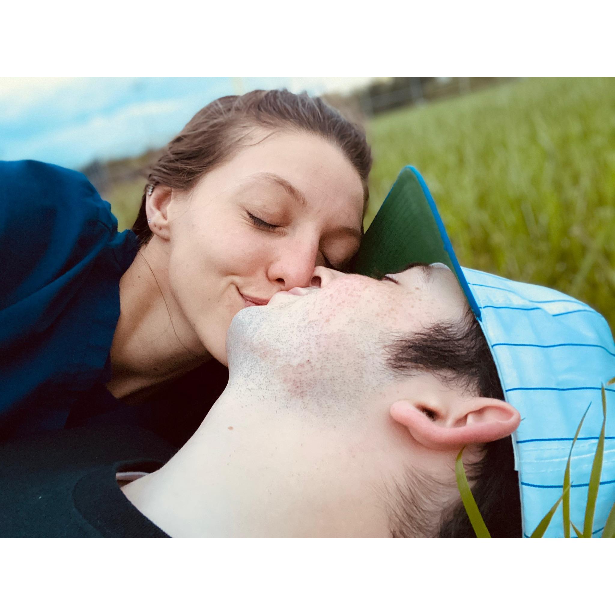 Kissing in a field... how stinkin' romantic are we?