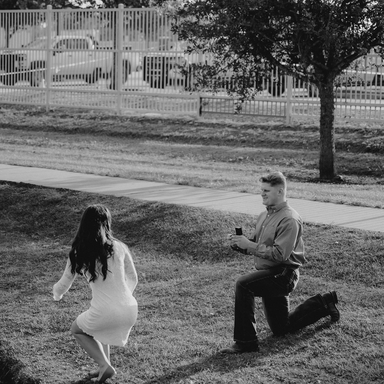 This photo caught me in the middle of turning around and standing up after Hunter called my name. He planned a complete surprise proposal!