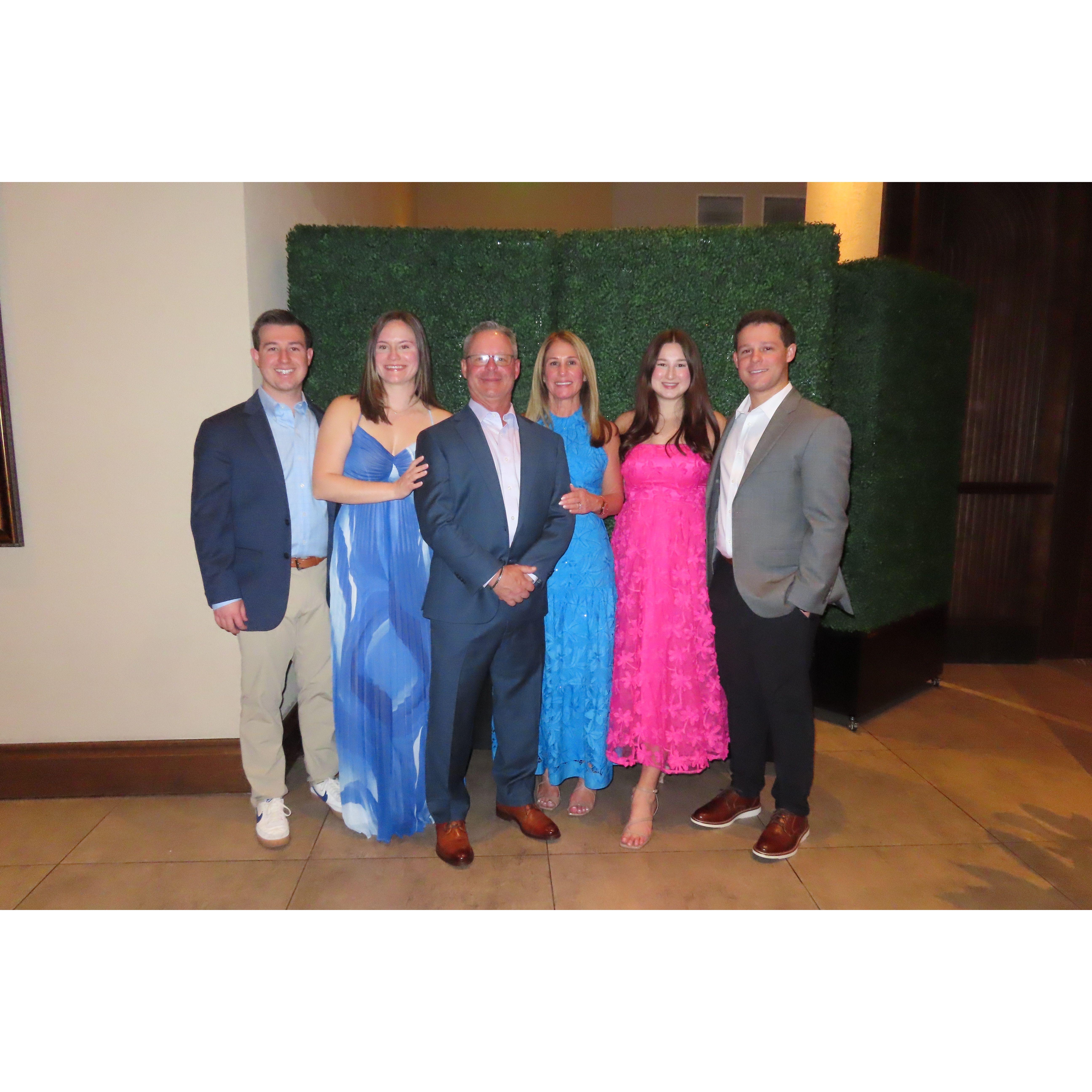 Zack, Sarah, Zack's parents, Zack's brother and fiancée at the welcome party before celebrating Zack's cousin getting married.