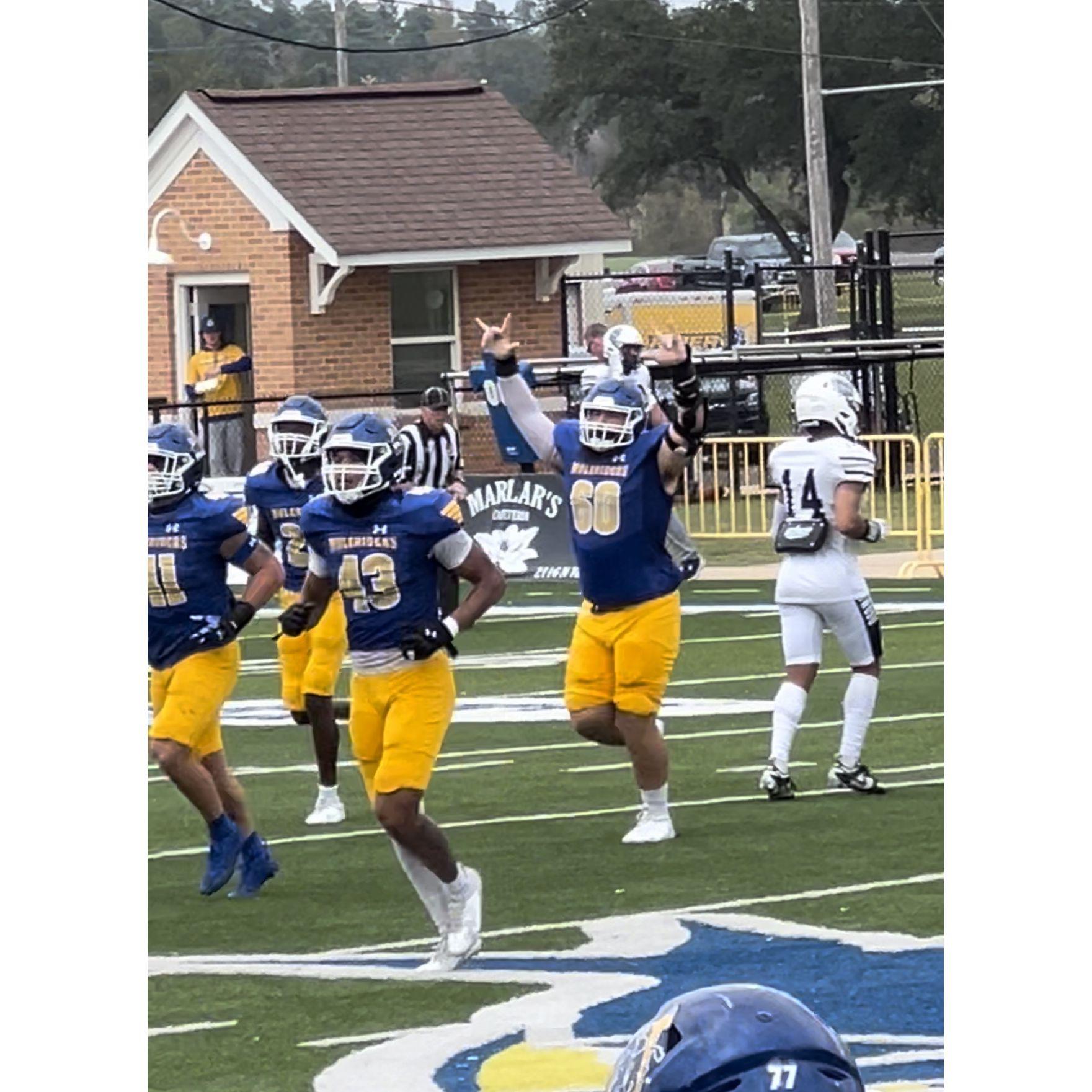 Carter had a fumble recovery and it was so awesome!! Lexi loves this photo so much!!