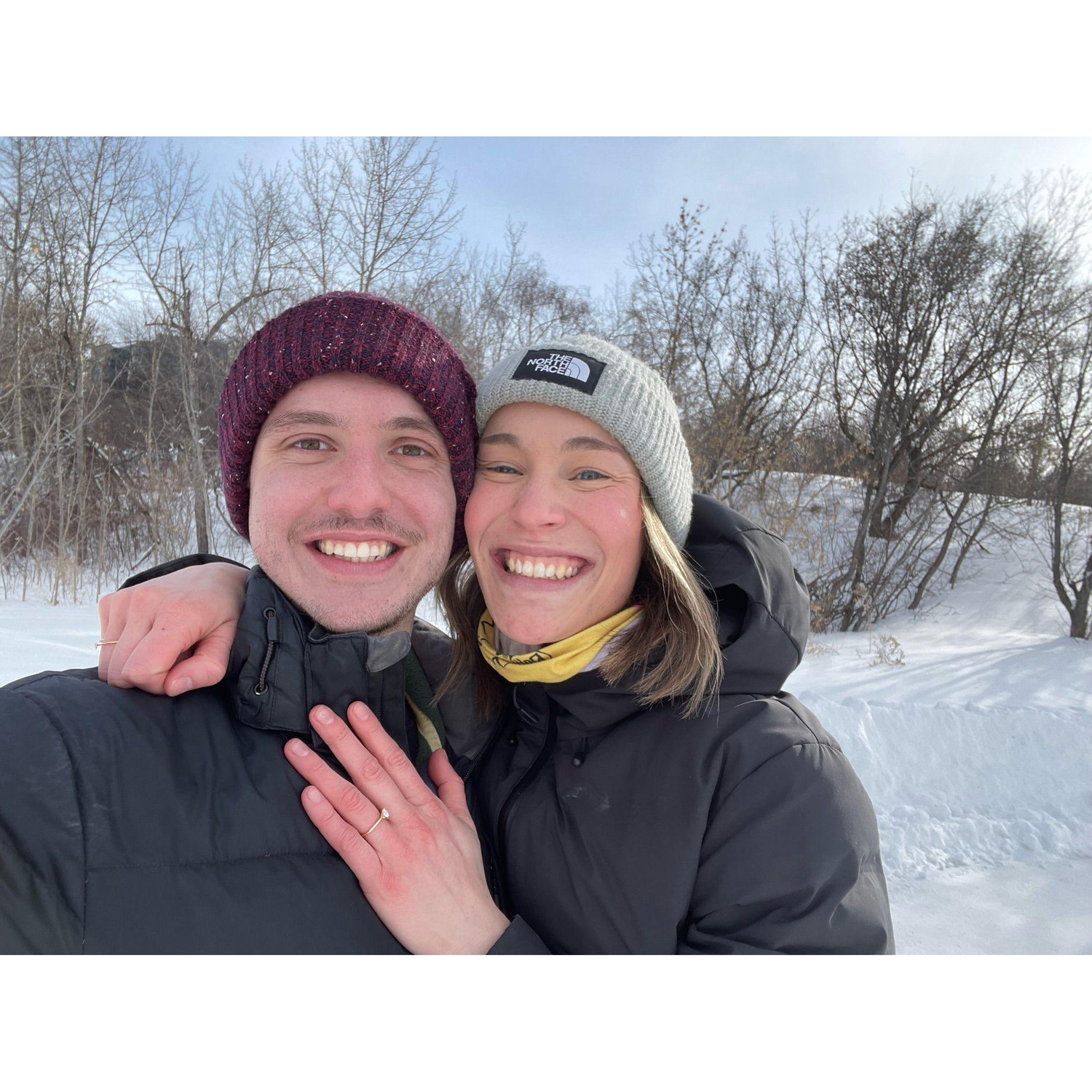 We're both smiling because Mike didn't lose the ring in the snow bank where his roommate had left it