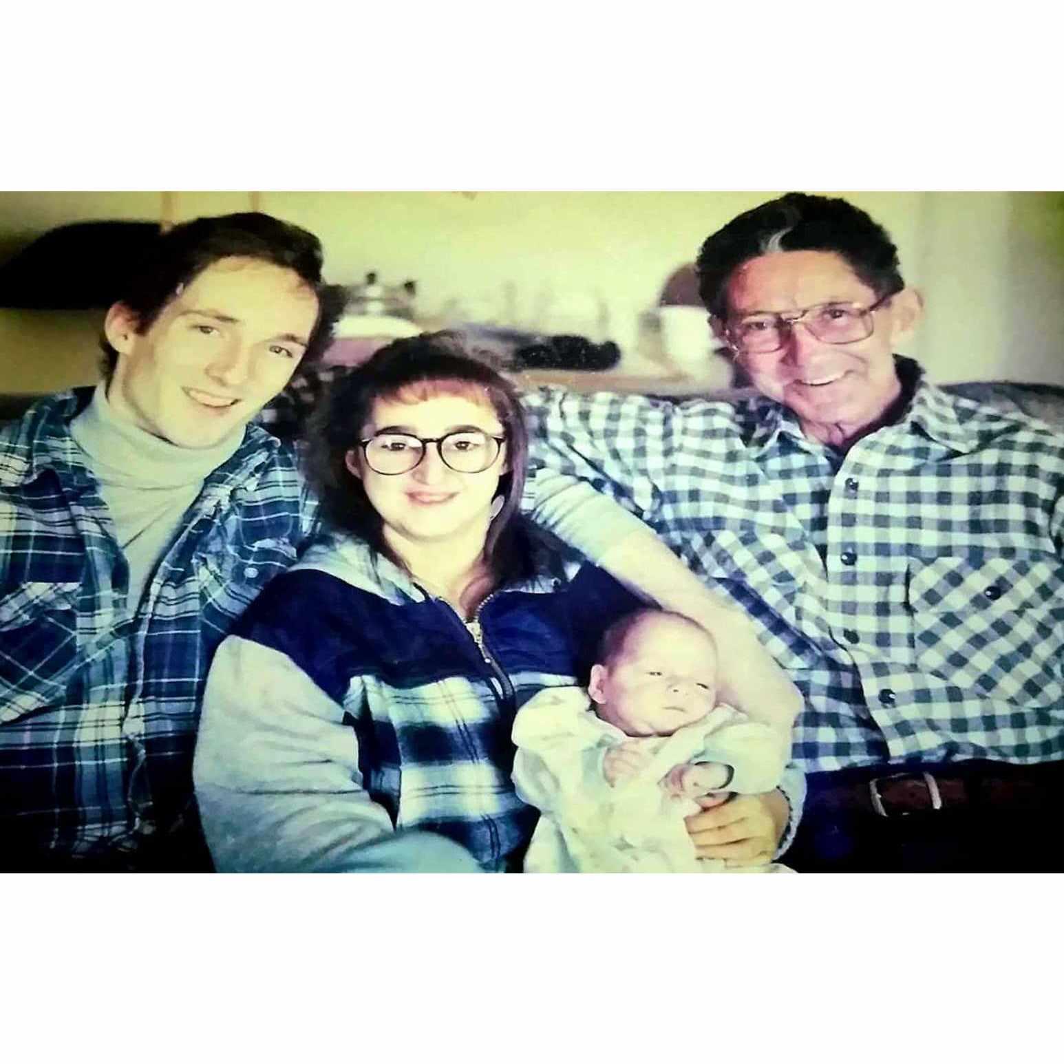 Sean with his Daddy, Mommy, and Grandpa Waldron not long after arriving home