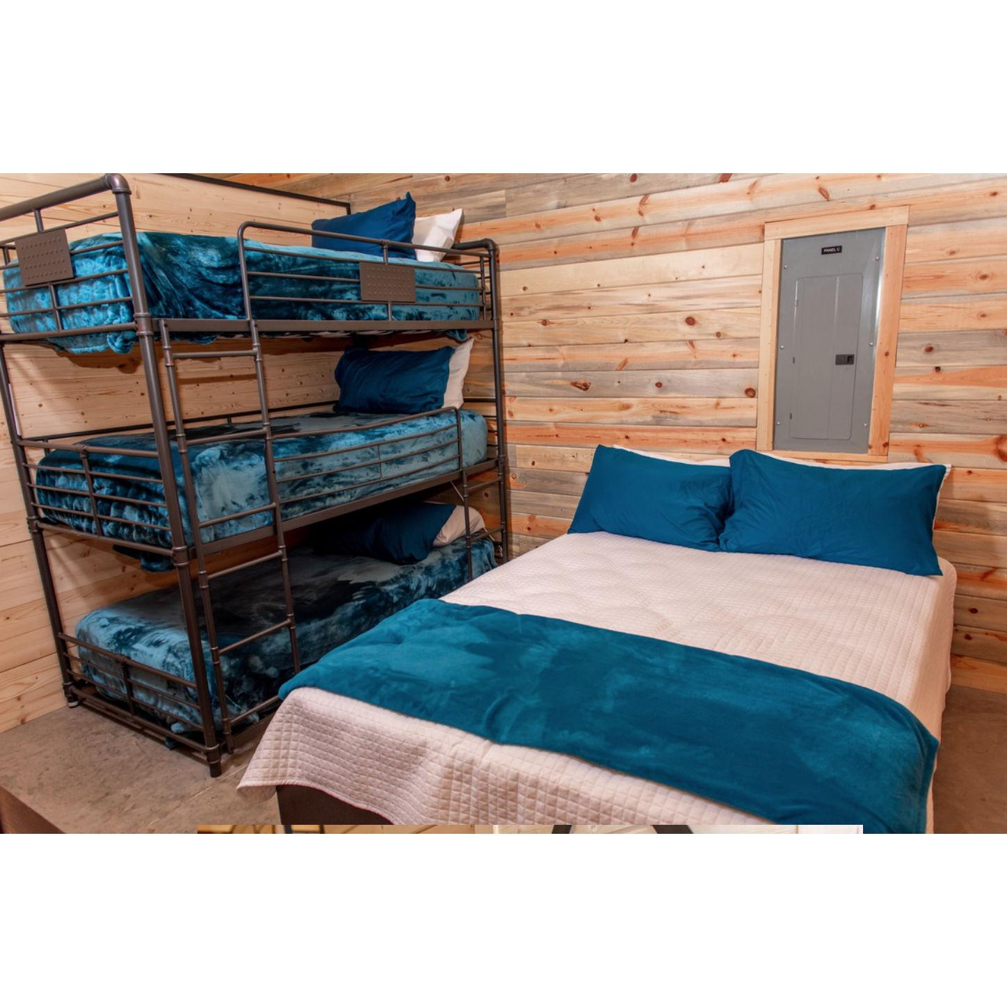 "Star" room is the largest in the bunkhouse sleeping 5 people. Has one queen bed and a triple bunkbed.