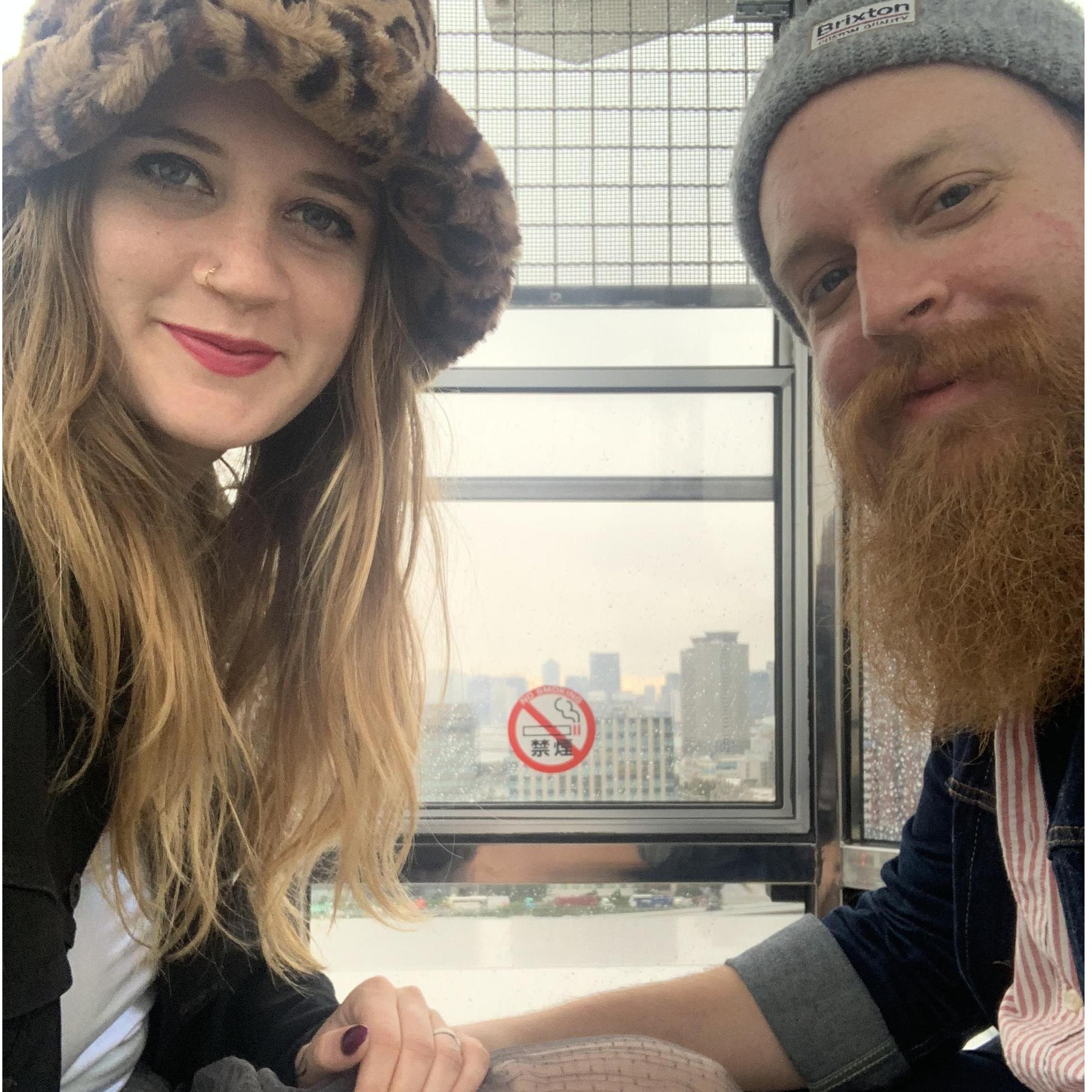 Kevin facing his fear of heights in a glass Ferris Wheel in Tokyo!