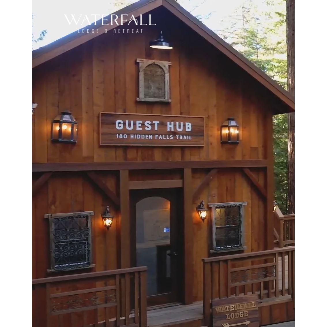 The "Guest Hub" at Waterfall will be the first building you see upon arrival.  There will be greeters to meet you and orient you to your cabin if you're staying onsite.  :-)
