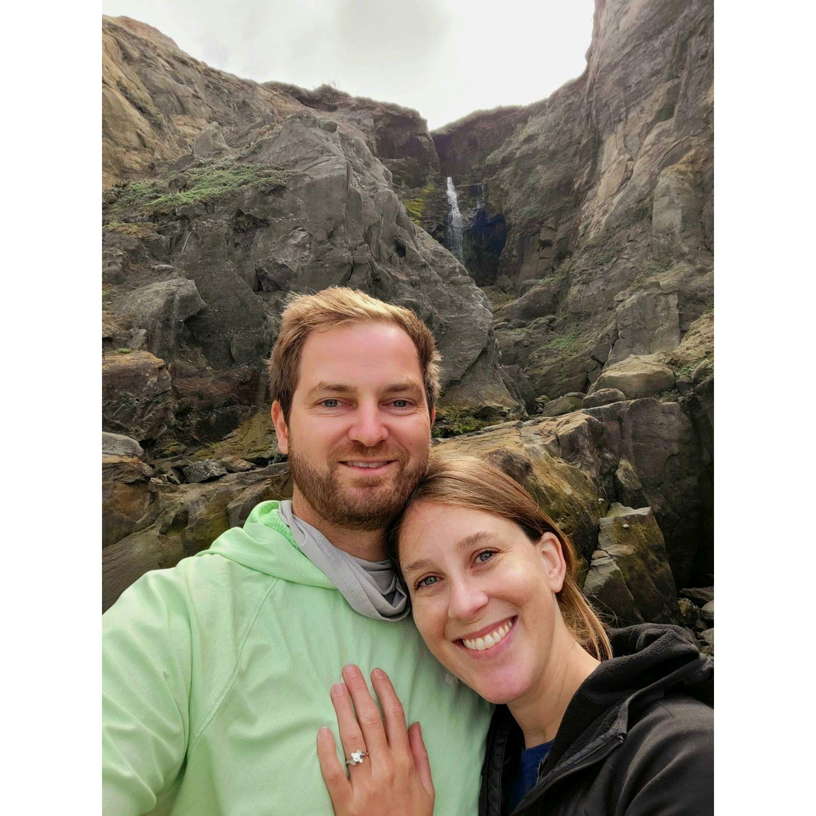 Paul proposed 9/1/24 at Floras Lake, Oregon.  We hiked along the beach to a cliffside waterfall, and he popped the question while Stephanie was looking for agates in the sand!