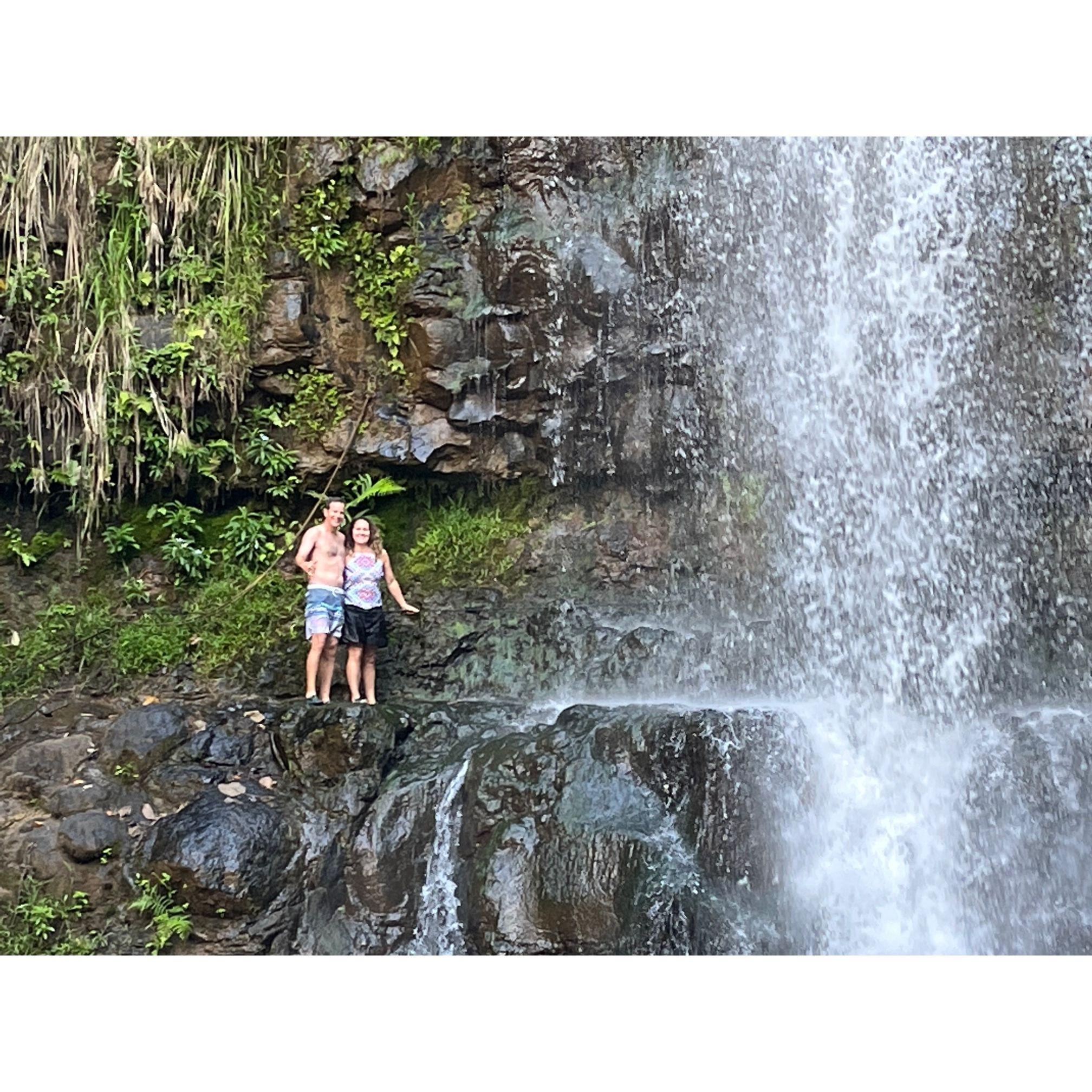 Climbing up to a waterfall in Hawaii.