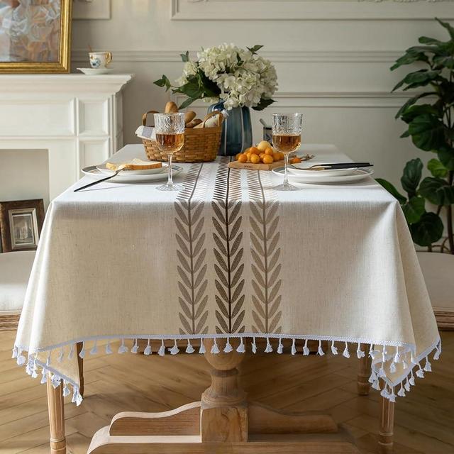 Oubonun Cotton Linen Rectangular Table Cloth, Wrinkle Resistant, Waterproof Tablecloth, Washable Farmhouse Table Cover with Tassels for Kitchen Dining Party, 55''x102'', 8-10 Seats, Beige