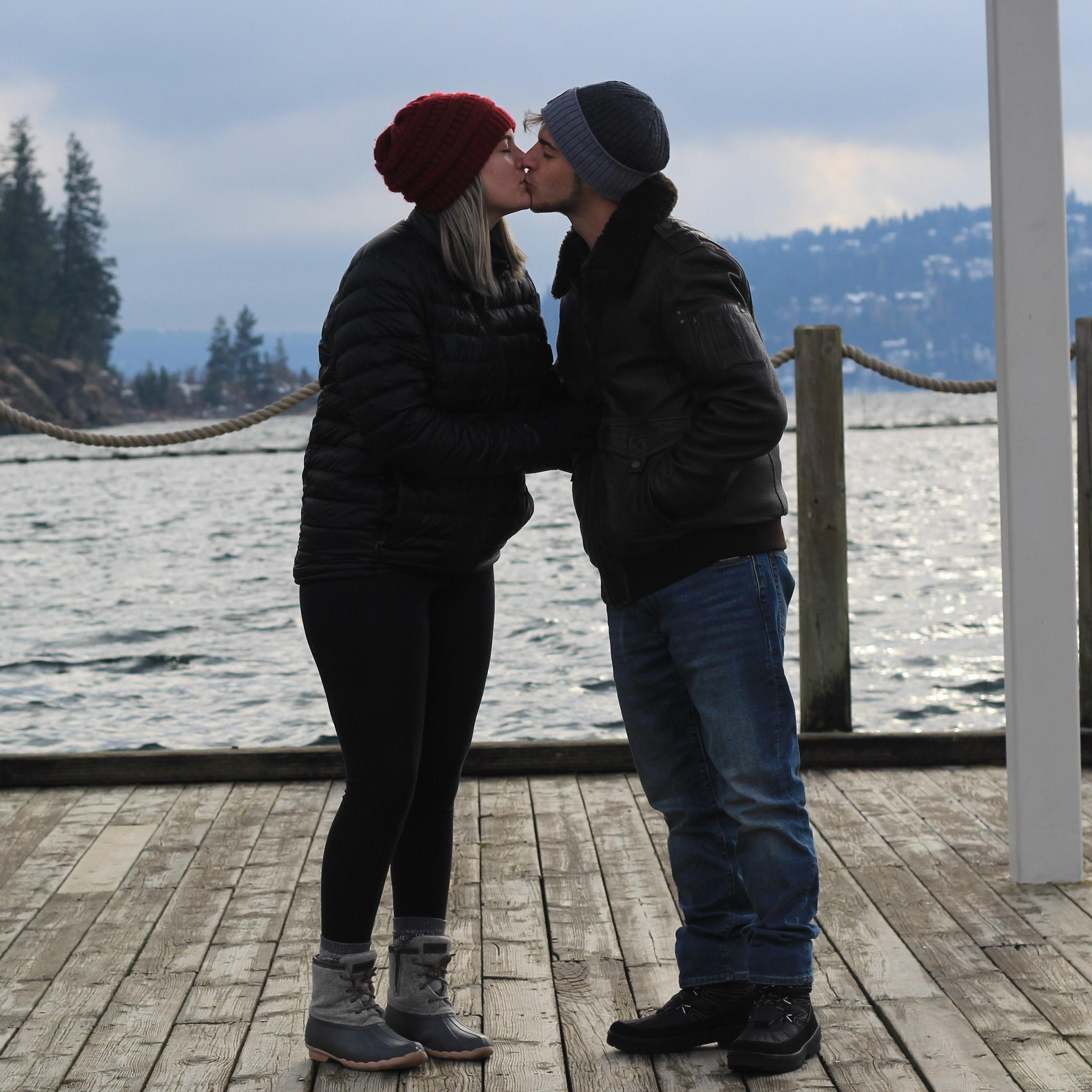 Sharing a kiss before he takes a knee...