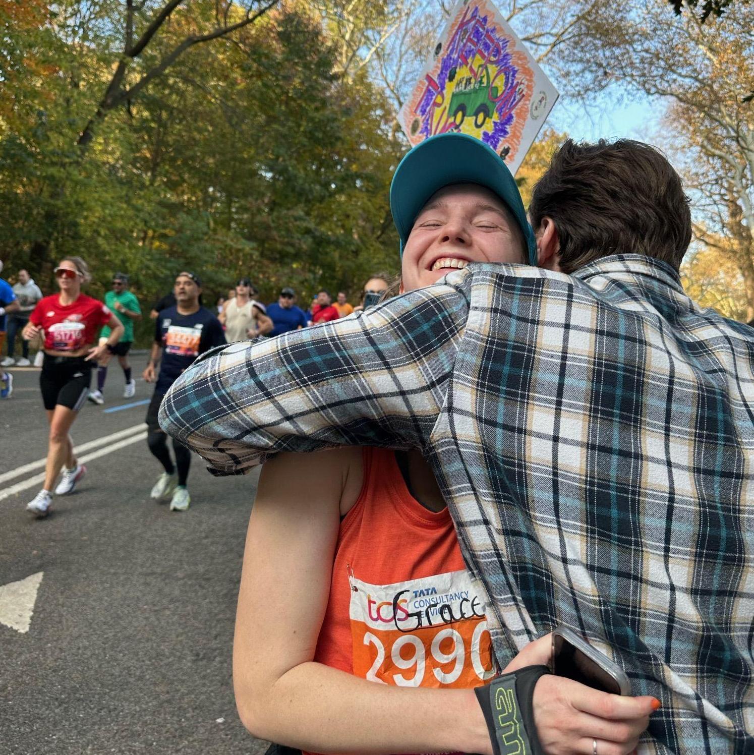 Sweaty hug in the final miles of the 2023 NYC Marathon, 11/5/2023