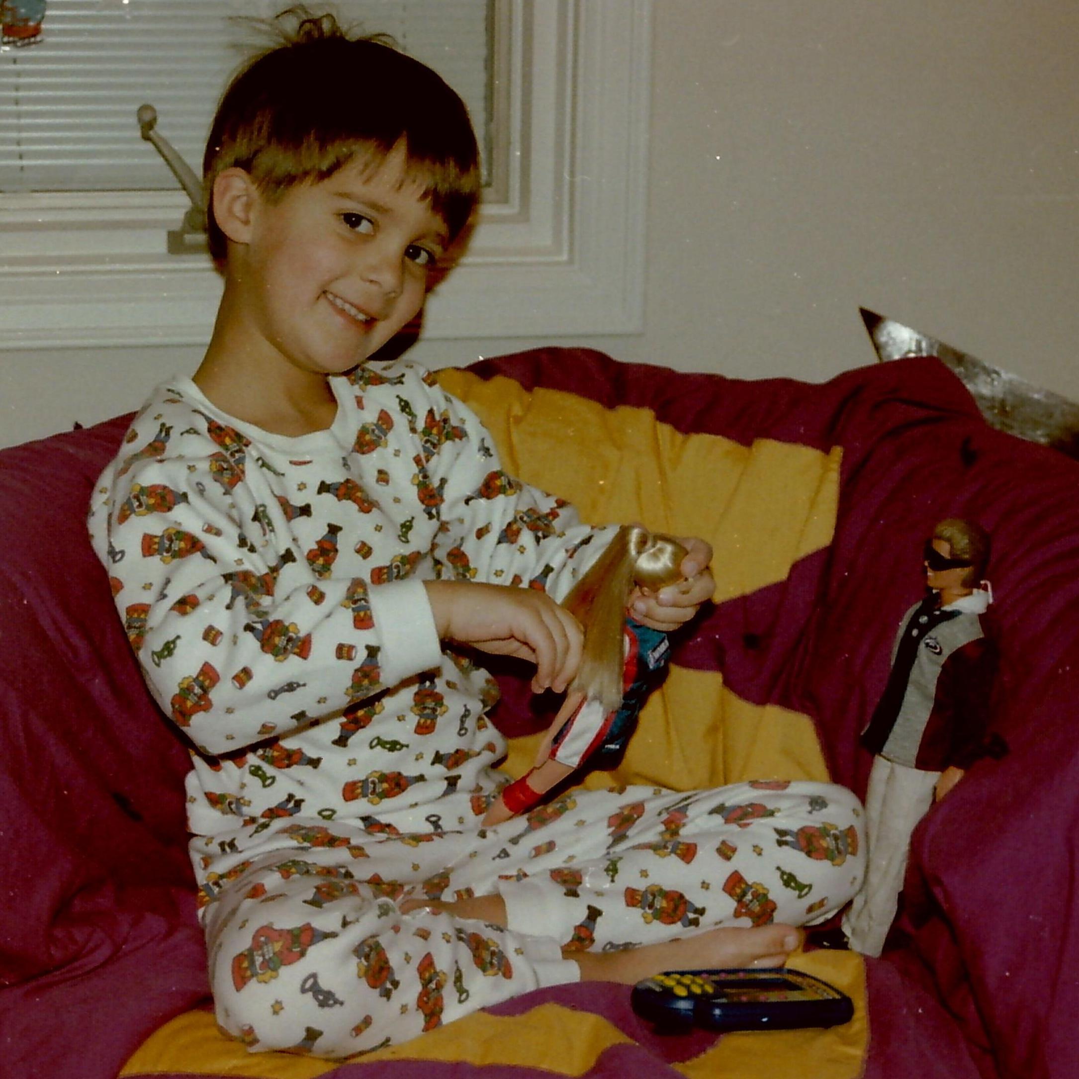 Baby Brian with his Barbies (before Jay ripped all the heads off...)