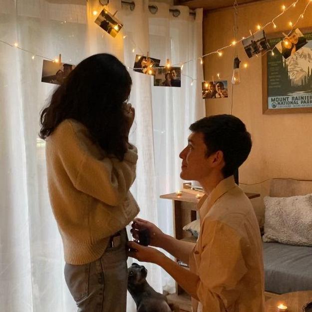 Tyler rented a cabin for a surprise trip to Mt. Rainier. He sent Jenn on a coffee run while he set up photos, candles, lights, and a new vinyl before surprising her with an engagement!