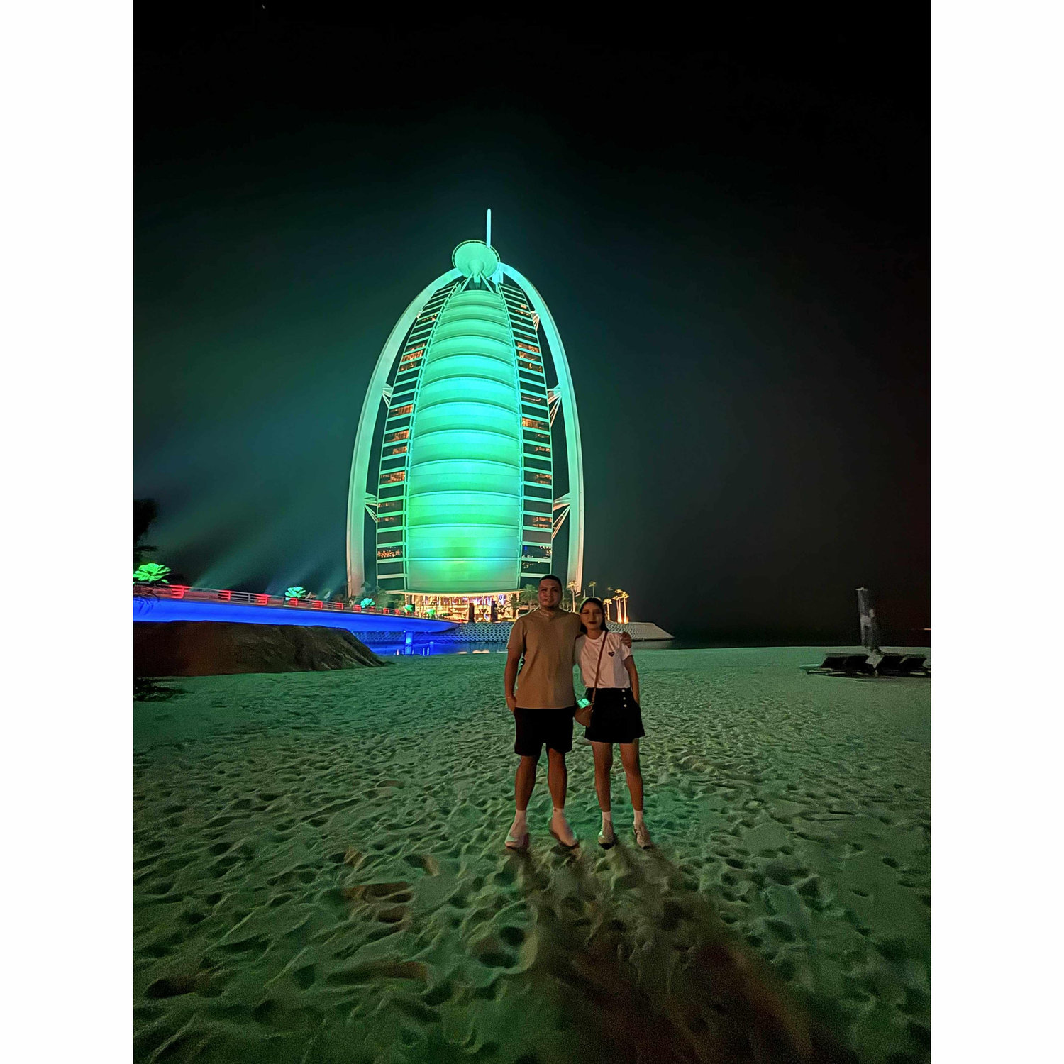 Under the dazzling lights of Burj Al Arab, making memories that shine just as bright. 🌌💚