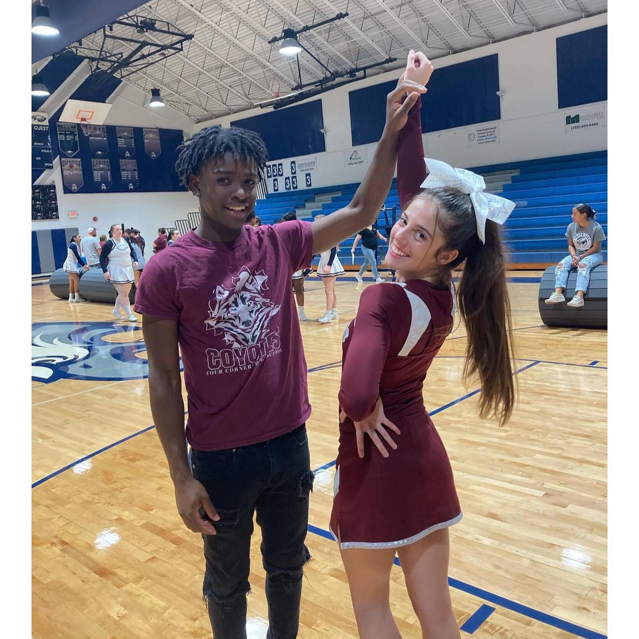 Dalan cheering Keisey on at her first senior year cheer competition