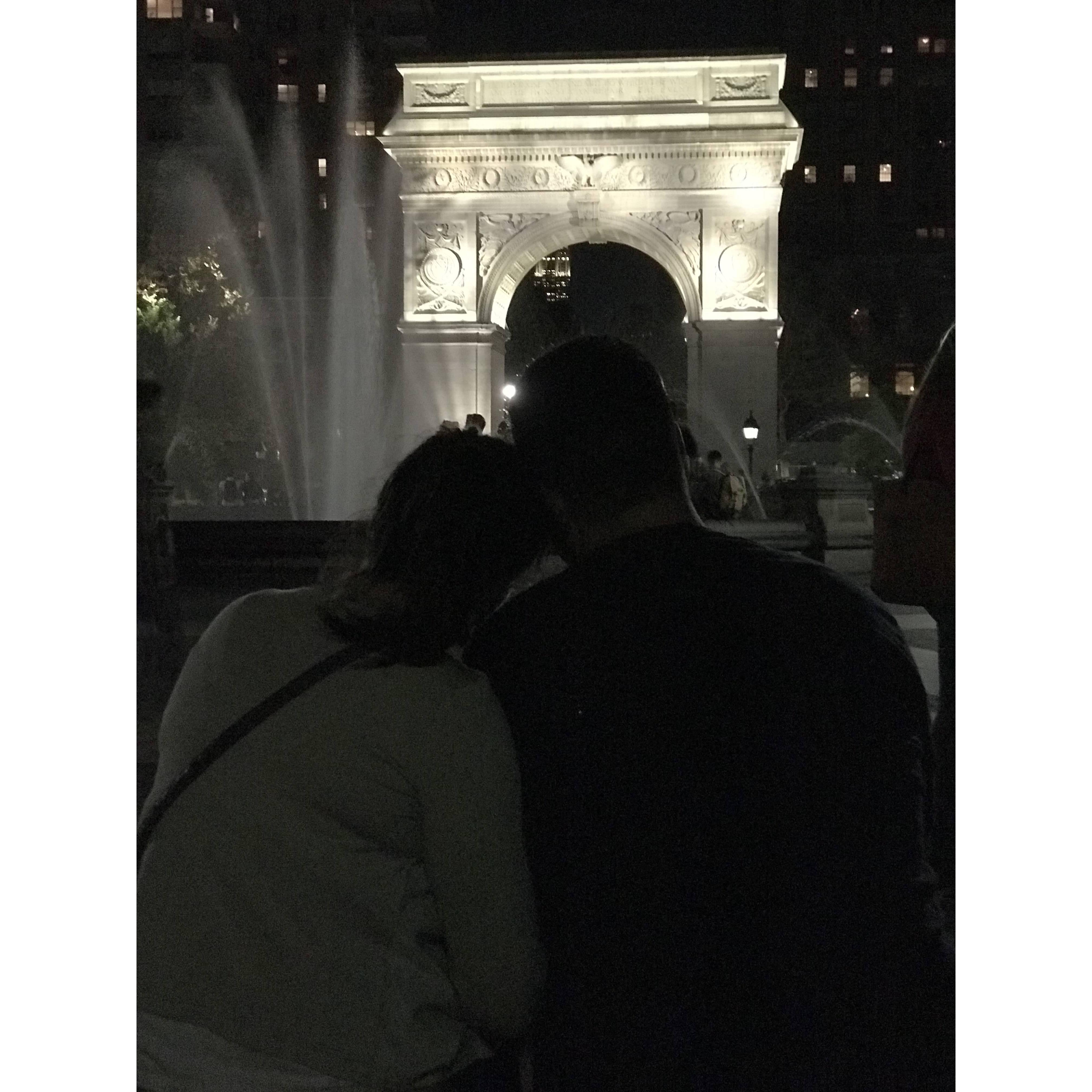 Cuddling up under the Madison Square Arch.