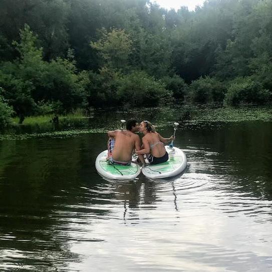 One of us is better at paddle boarding than the other..