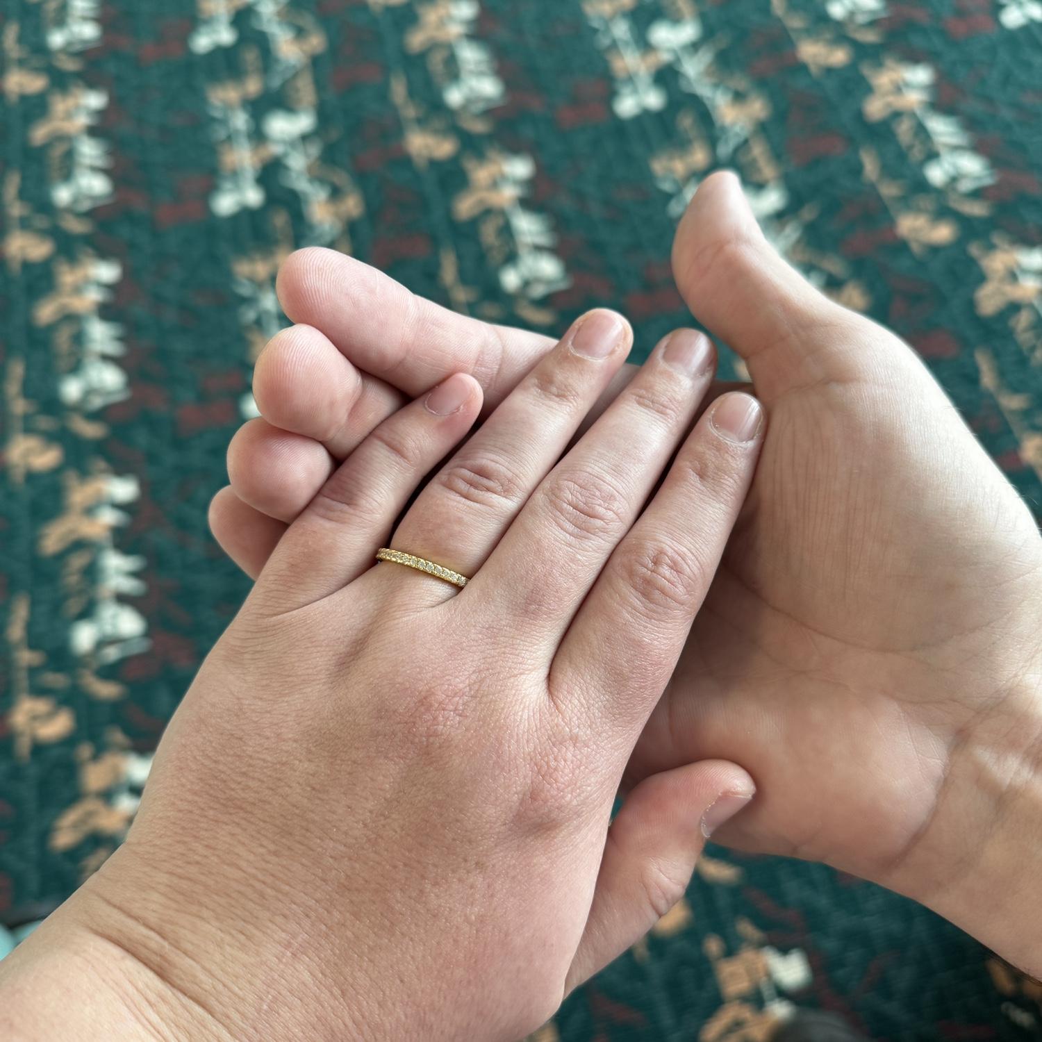 Our engagement announcement picture for social media ft. the infamous MCO airport carpet - October 2024