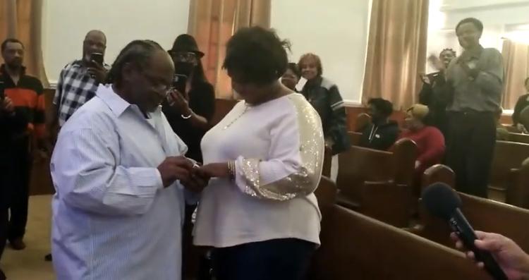 Willie placing the ring on his fiancée’s finger