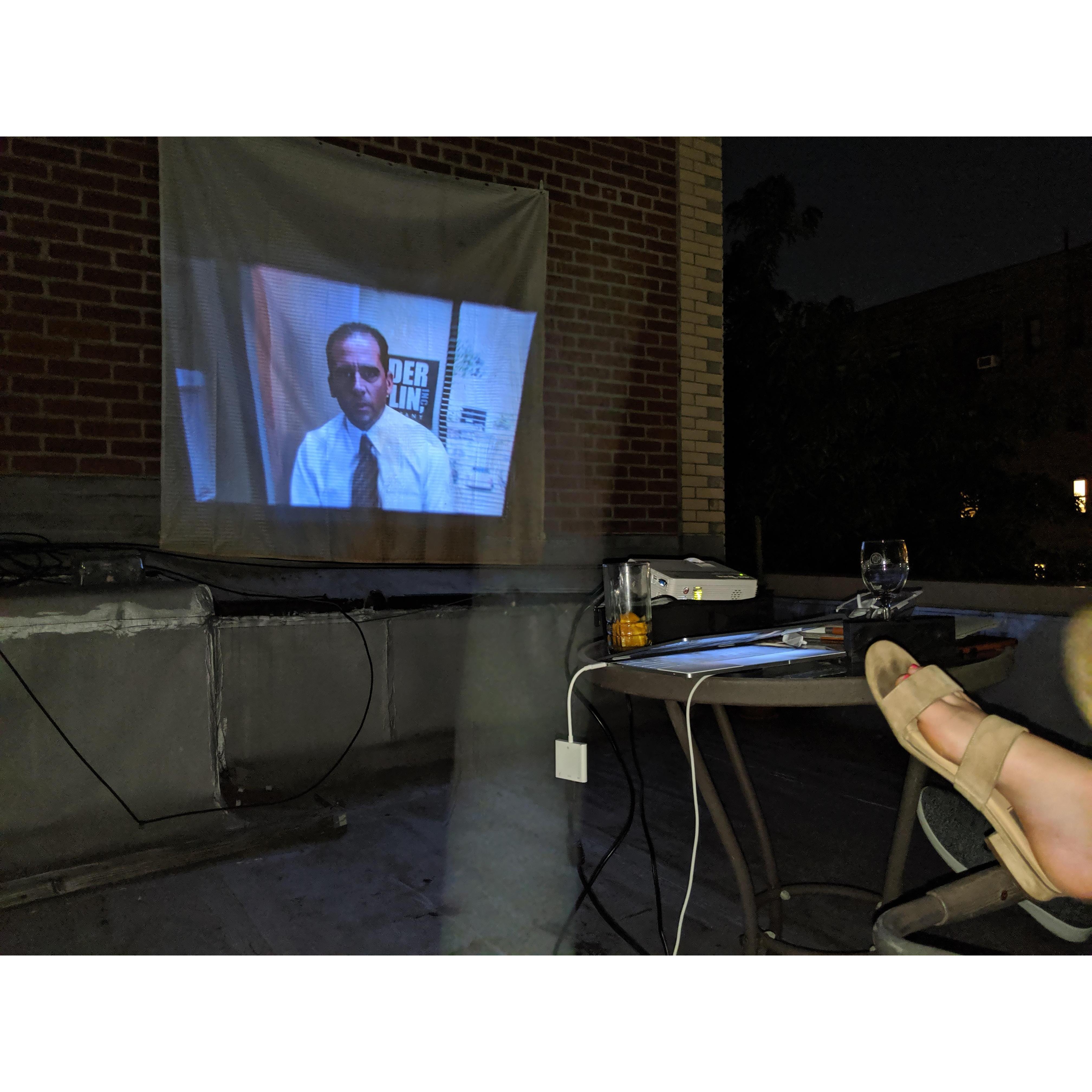 Surprise Date! Set up a rooftop movie night at a friends apartment. Chose to watch The Office, of course.