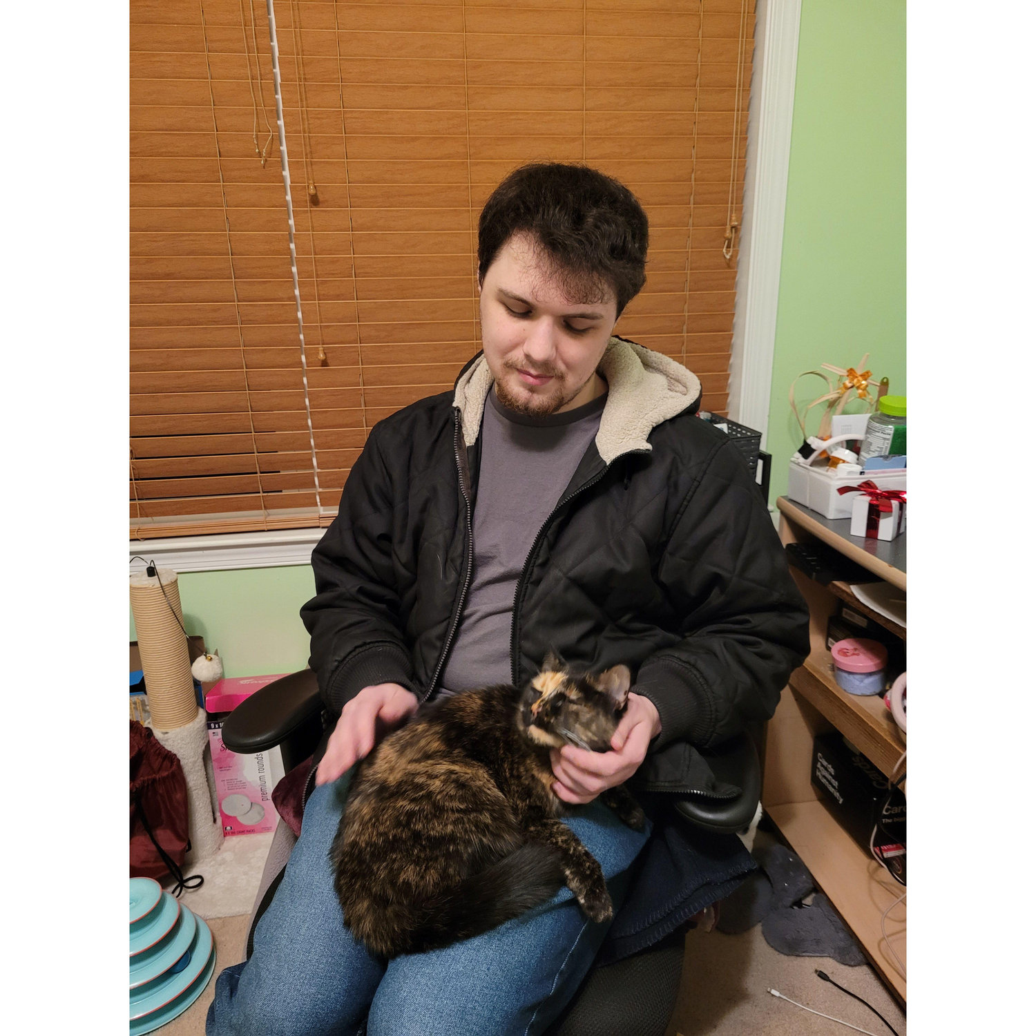 Josh being loved on by Heidi the cat. Heidi seems to like Josh more than Isabella, the traitor