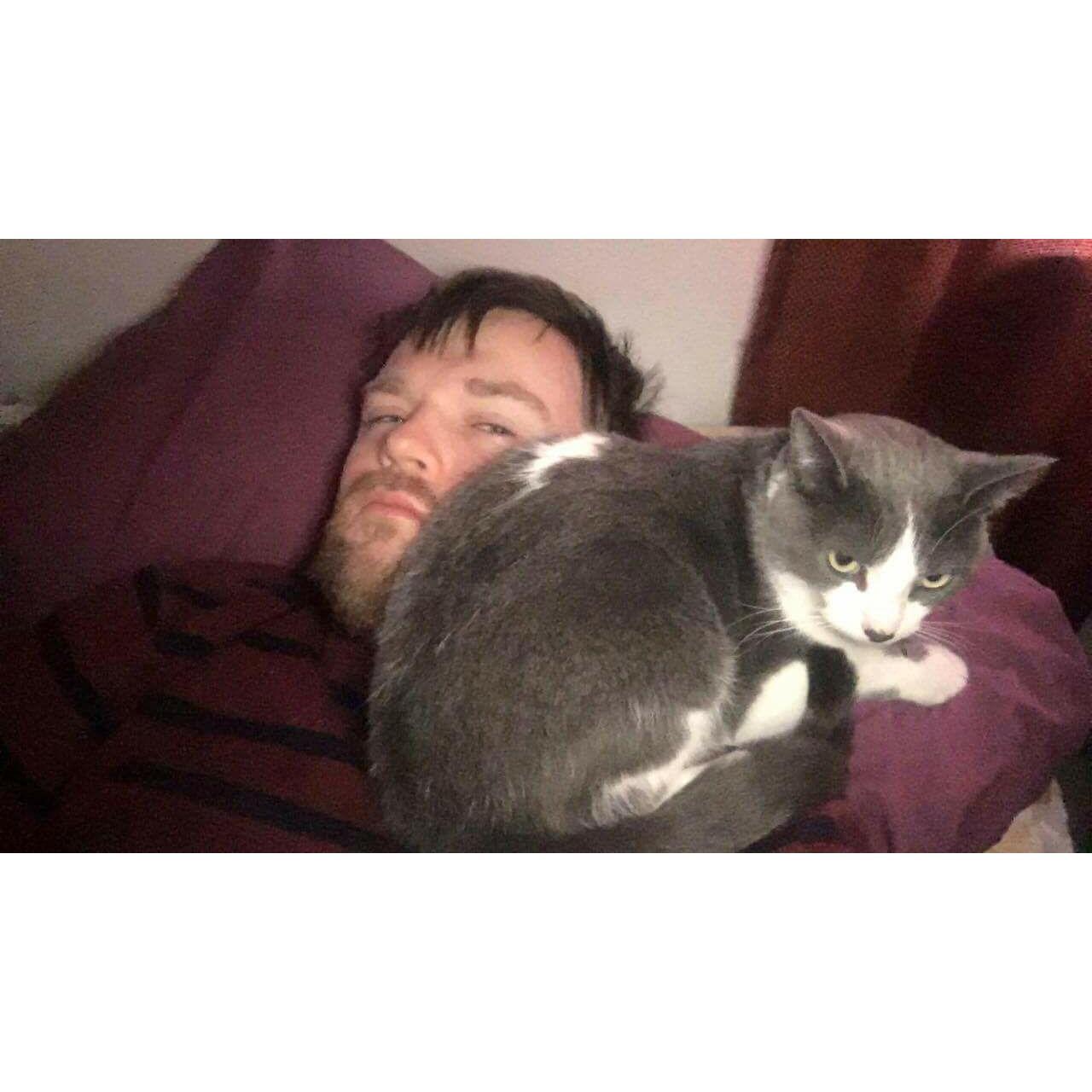 Reggie took a while to accept Aleksander into his life, but after the first month or two he decided that his dad is his favorite couch.