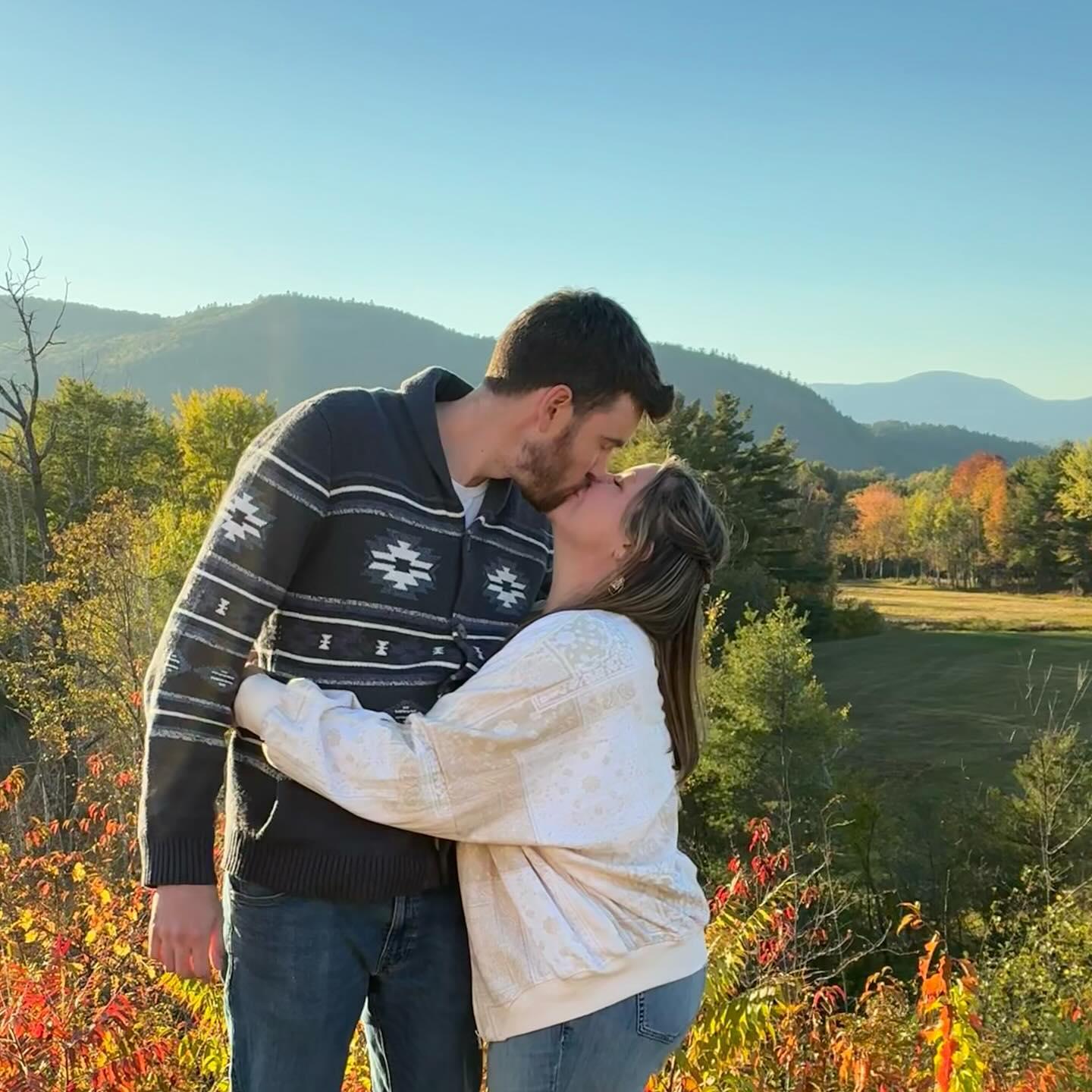 A proposal and acceptance sealed with a kiss.