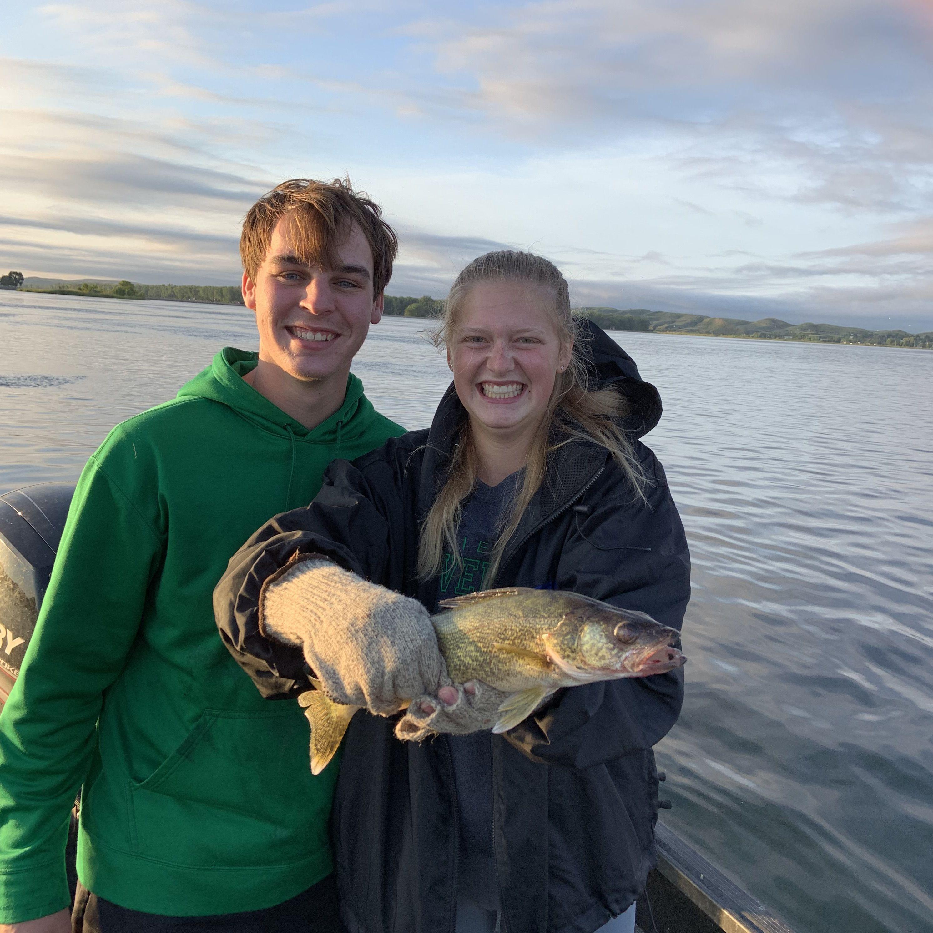 Groom teaching the Bride how to fish, Fall 2019.