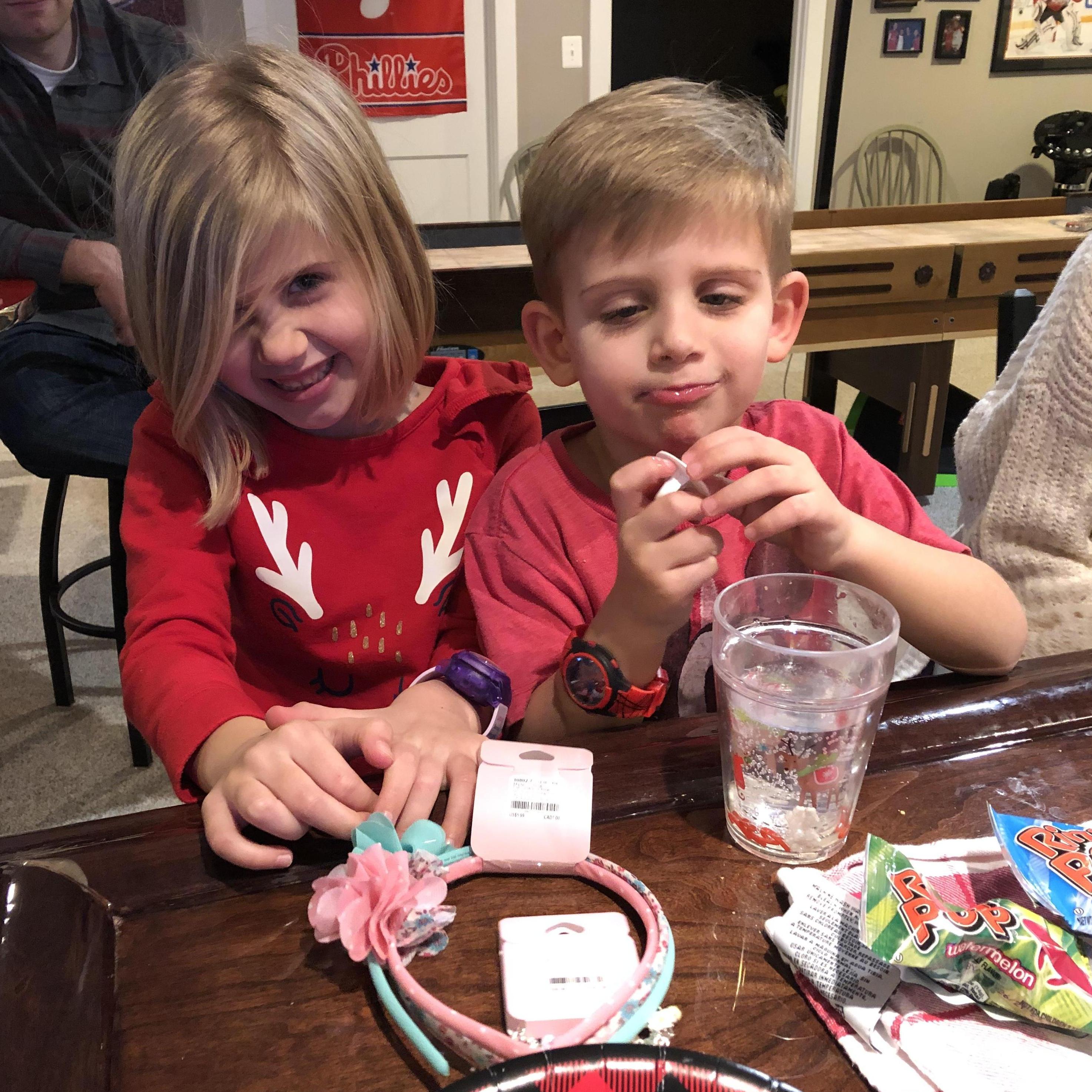 Flower headbands and bracelets for the flower girl and ring pops for the ringer bearer.