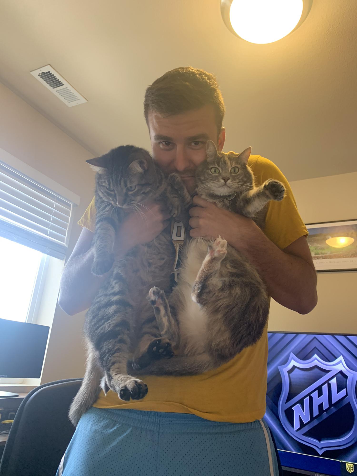Adam and our cats, Dexter and Mo 💛💛