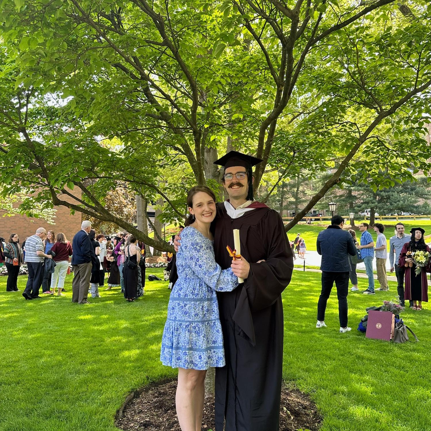 Kam graduates with a Masters, May 2024