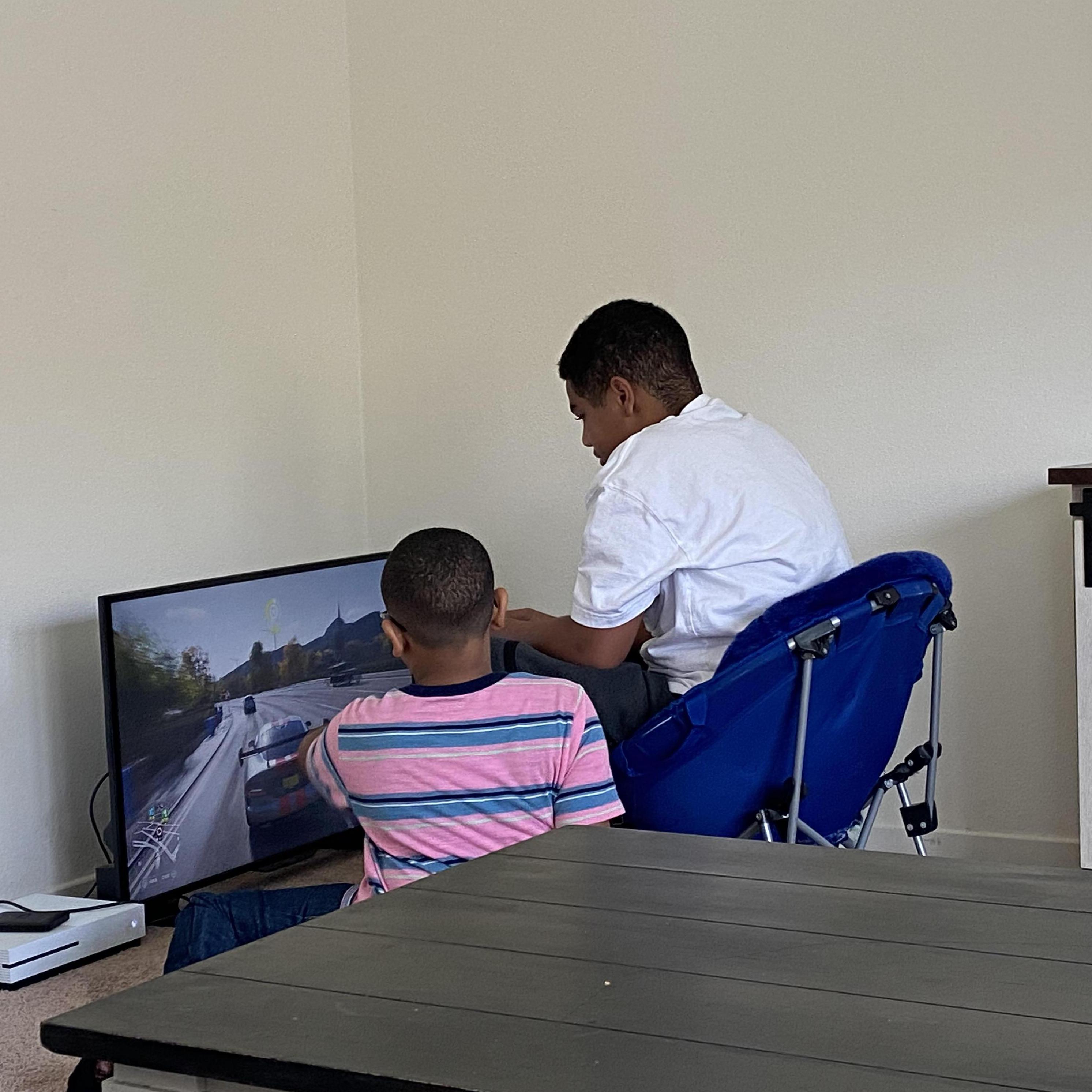 Isaiah and Desmond playing video games.