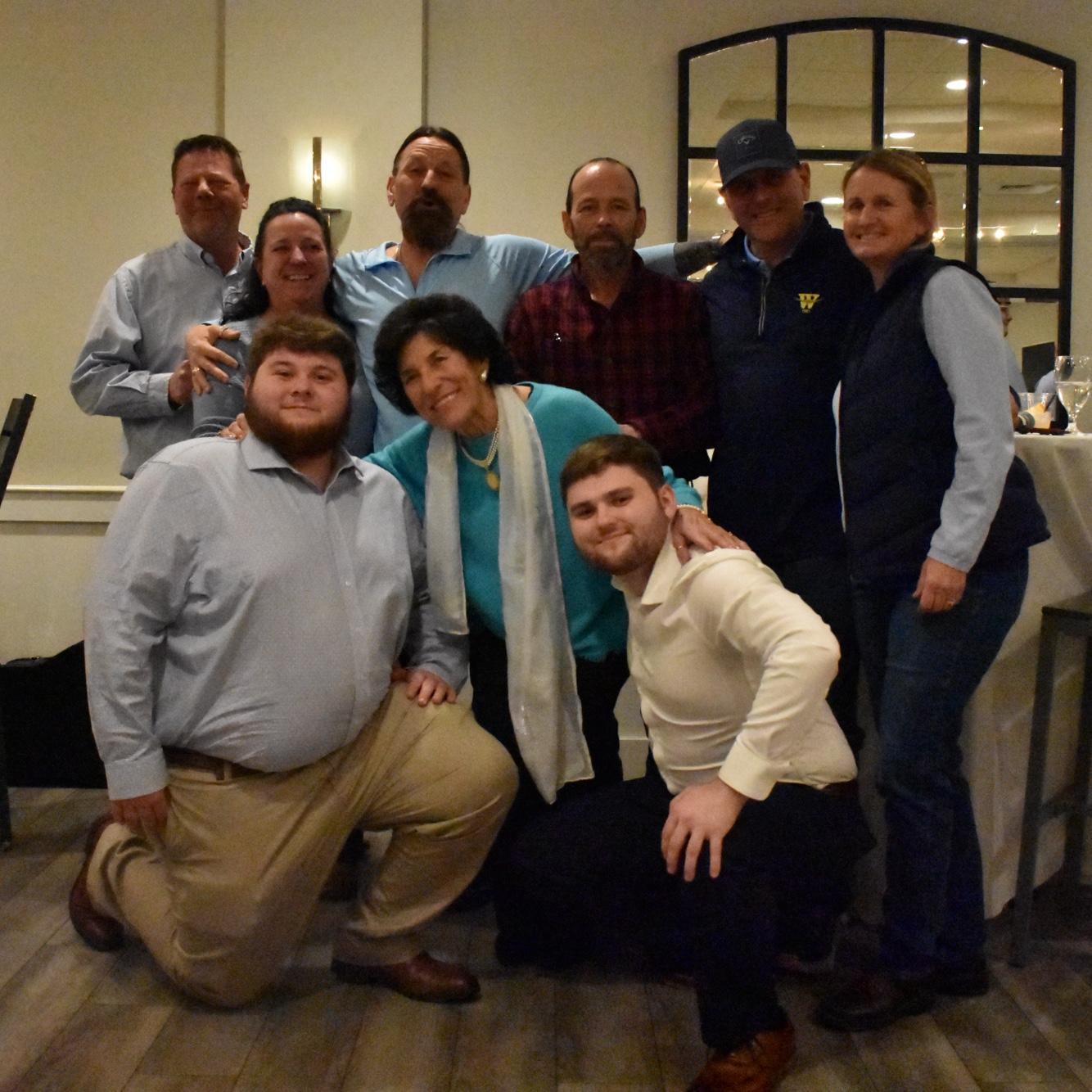 LEFT TO RIGHT: Logan’s uncle Craig, aunt Laura, father Scott, uncle Mark, uncle Herb, aunt Sharon, brother Dylan, Nonna, & Logan