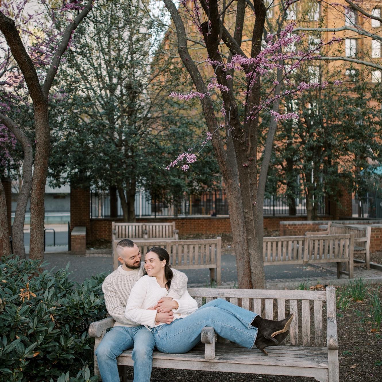 Two lovers sitting on a bench.