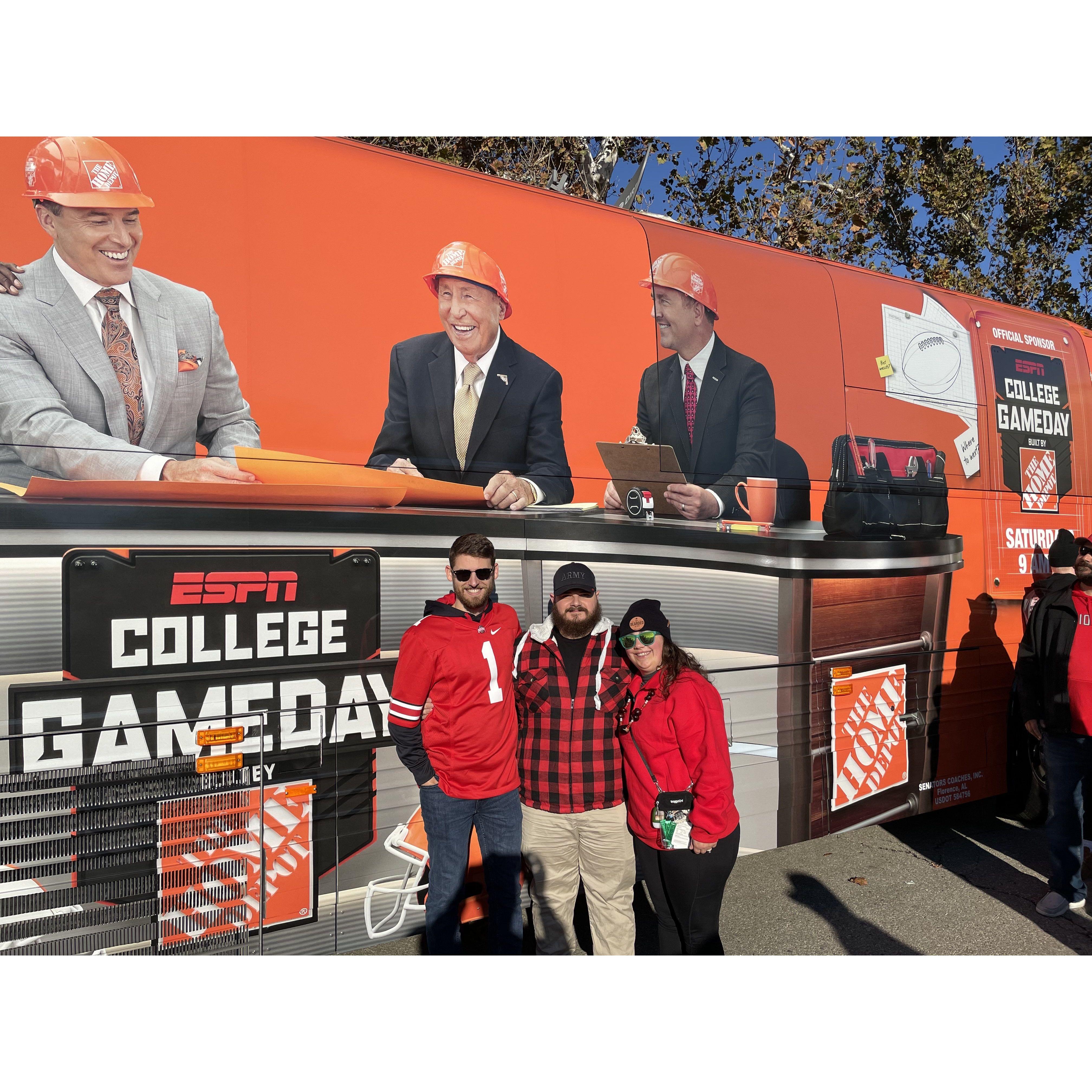 Justin Walter and Erika in front of the Game Day Bus