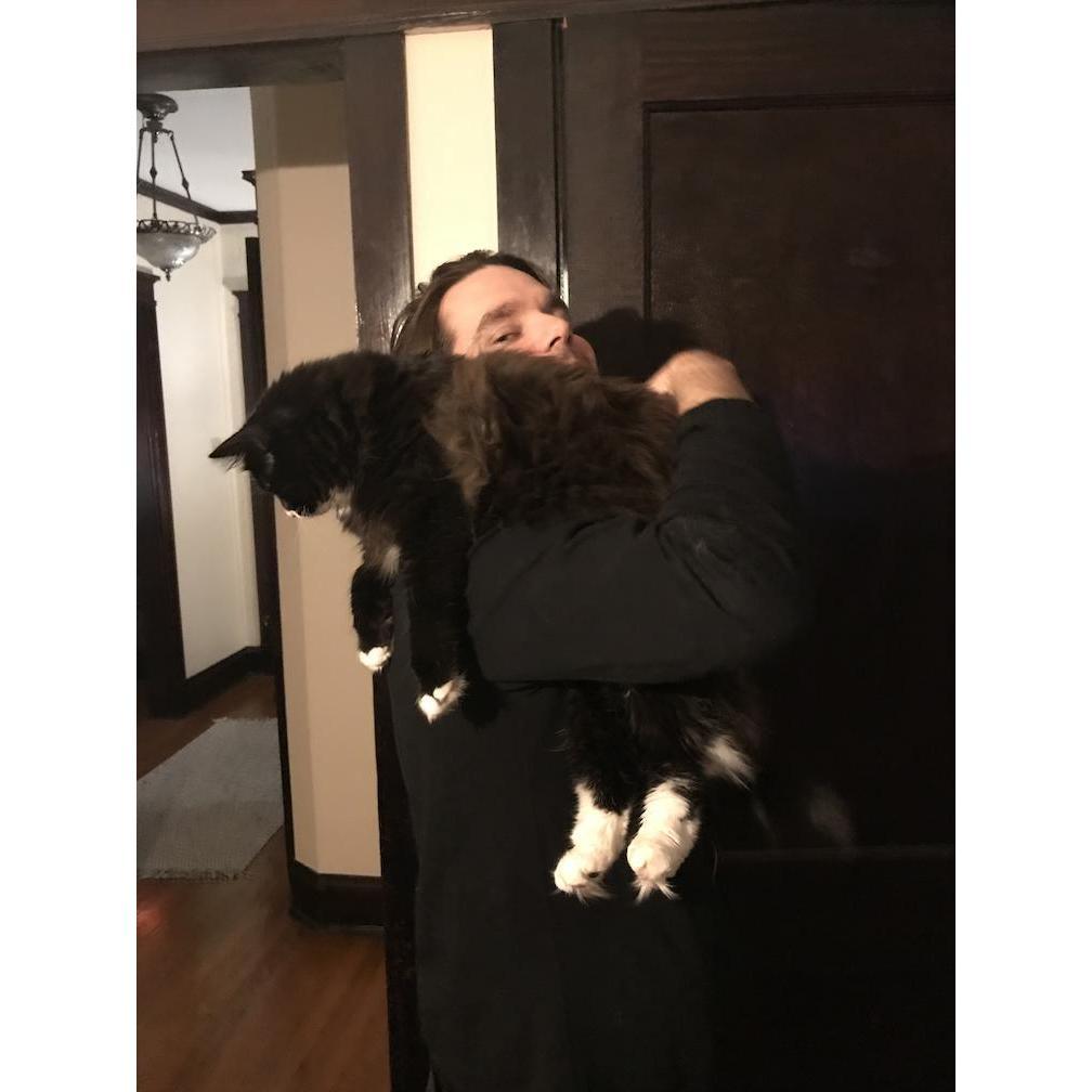 Gannon holding one of our monsters in our Chicago apartment