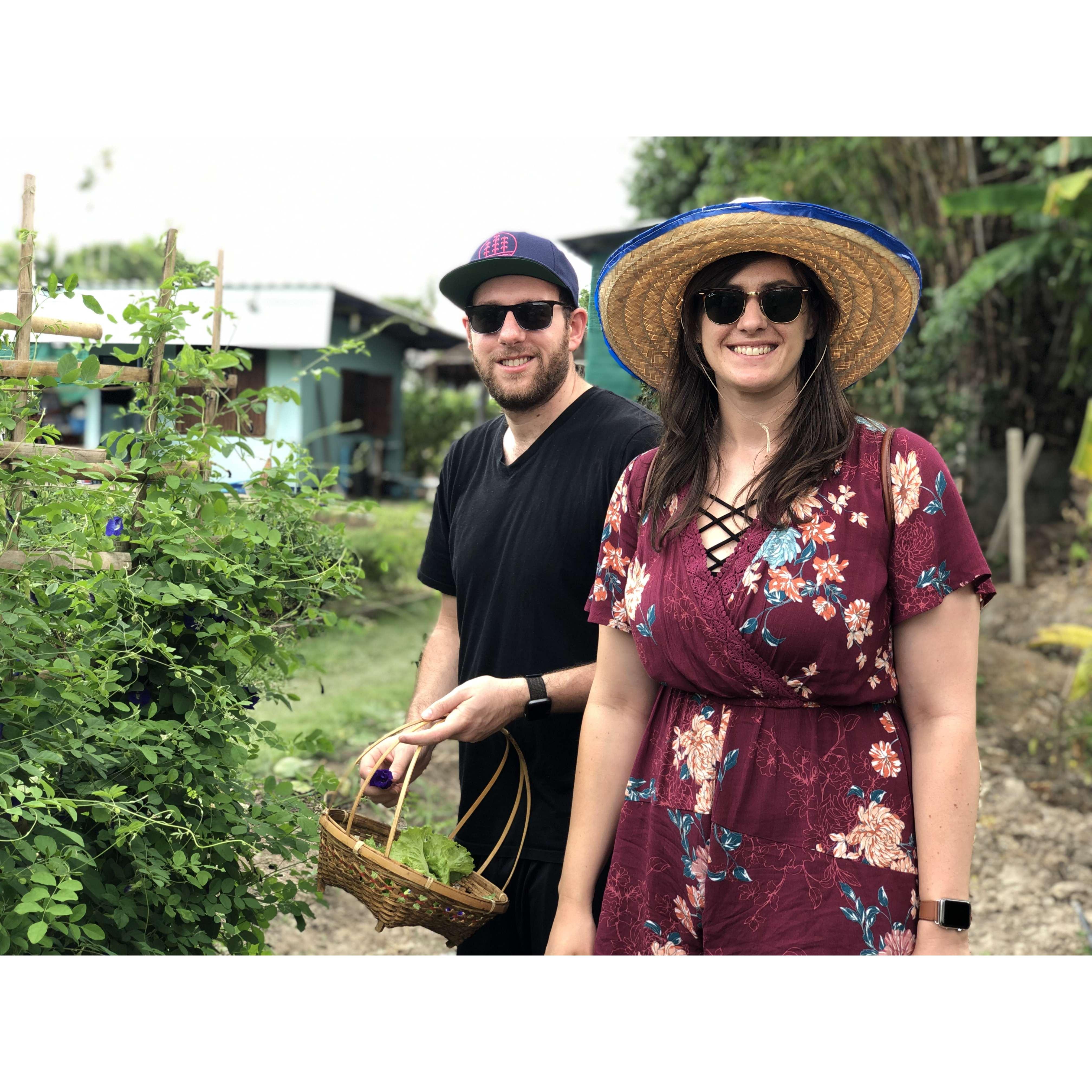 Picking ingredients for a cooking class on our trip to Thailand in 2019