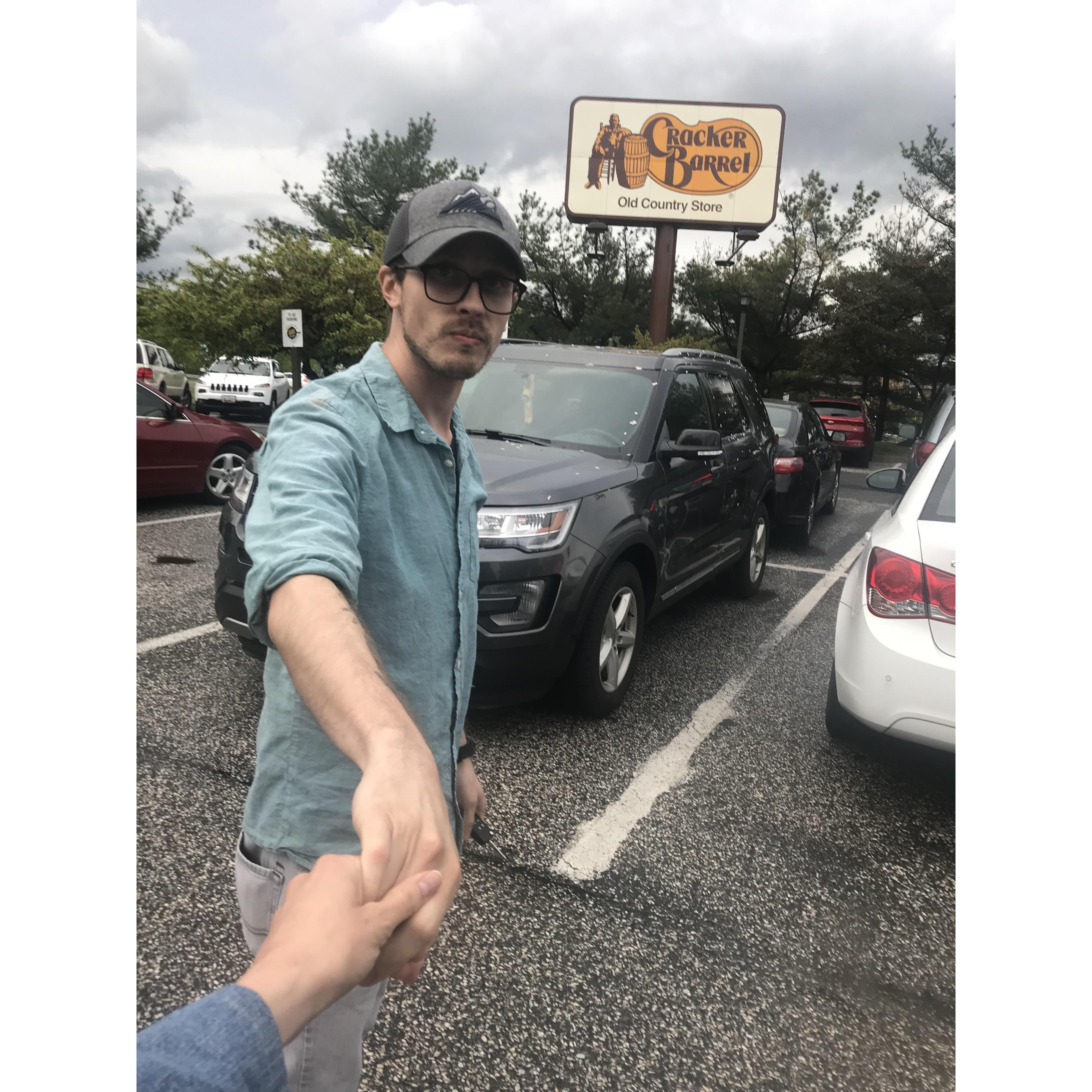 I guess there is some thing where girls take pictures of themselves grabbing their boyfriend's hand as they are walking somewhere...? This is that at a Cracker Barrel...