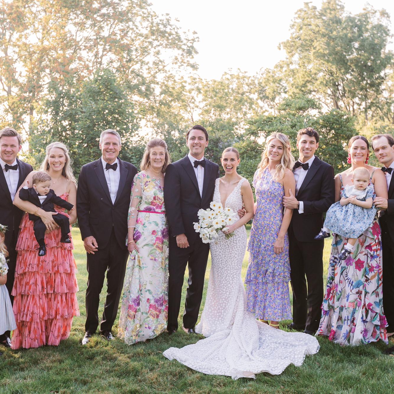 Carrie's family! From left to right it’s, Copley (niece), Wyatt, Beth, JW (nephew), John, Cathy, Chase, Christina, Carrie, Robb, Maggie, Quigley (niece), and Andrew. Also a good example of dress code!