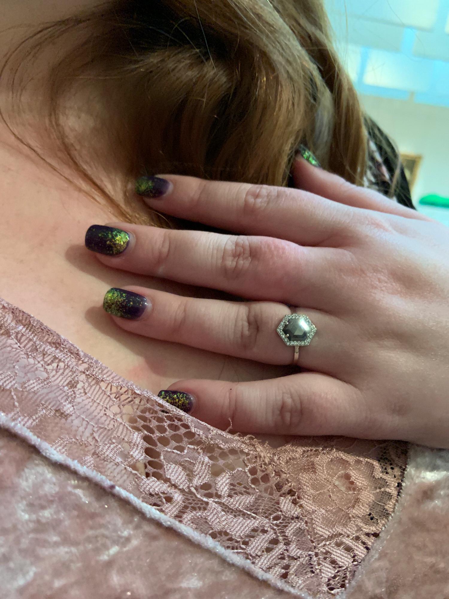 The beloved ring! We wanted something different so he chose a custom hexagon cut black diamond, exactly what she had dreamed of.