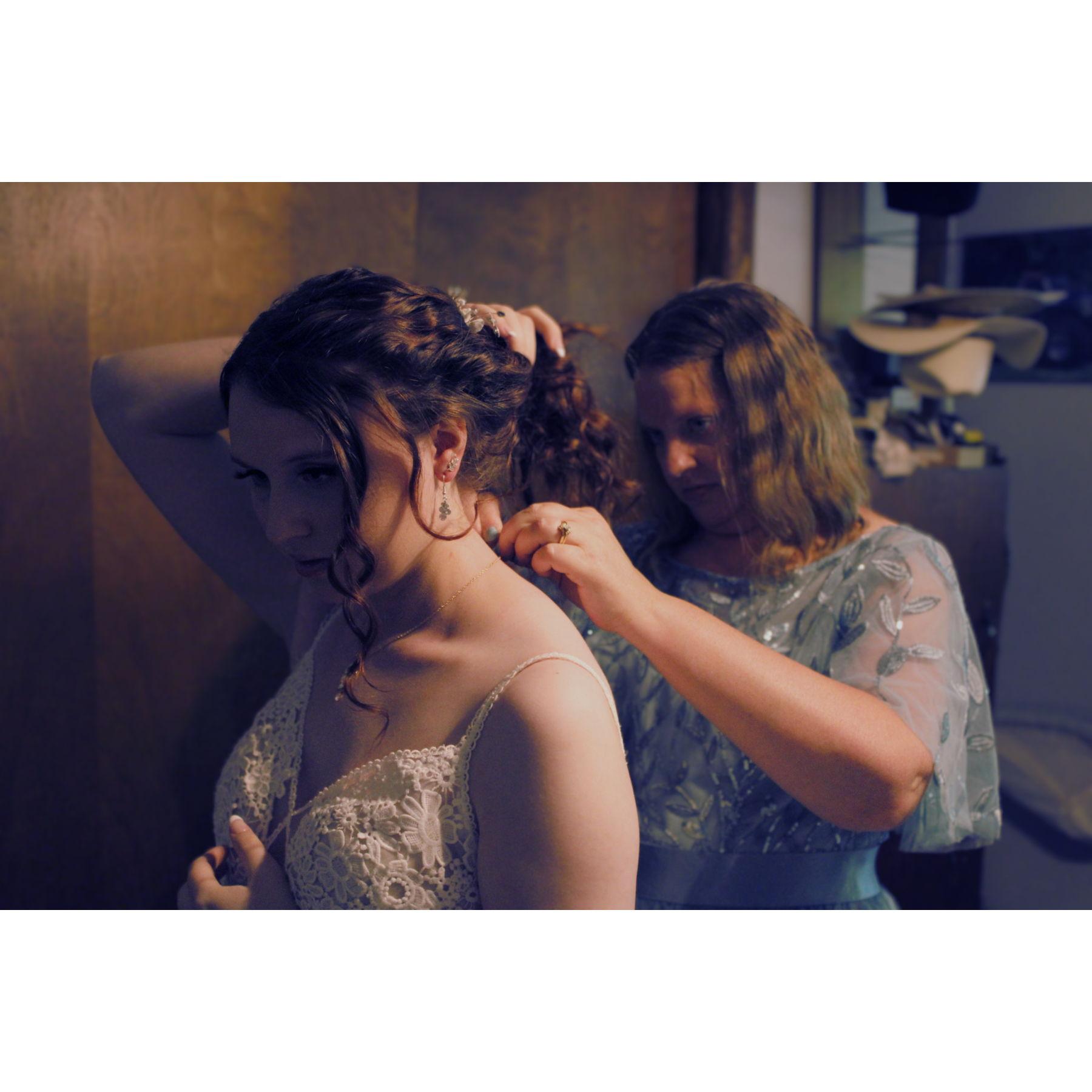 Jennifer putting on Kristina's Necklace