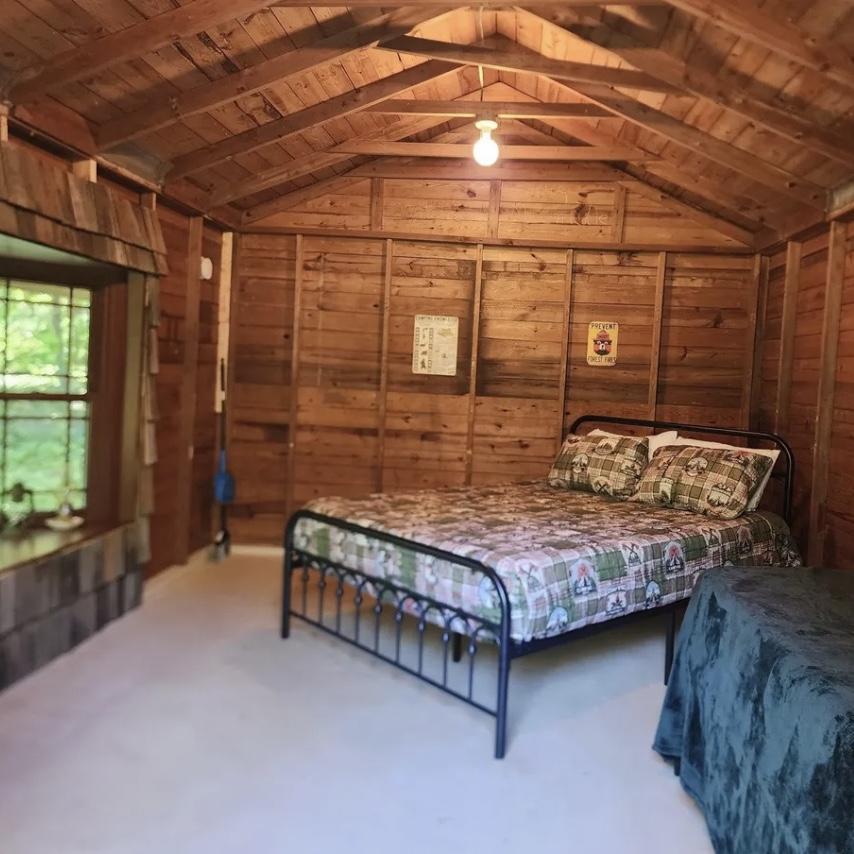1 of 3 Multi- bed Single room cabins available right outside venue hall with firepit area and shower house.