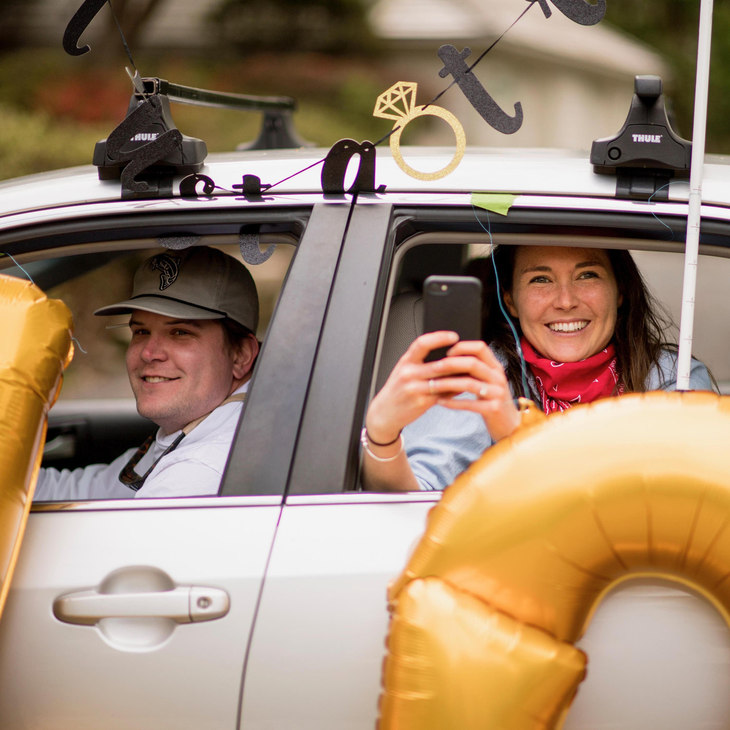 Liz + Greg in the car pararde! - Scott Zuehlke Photography