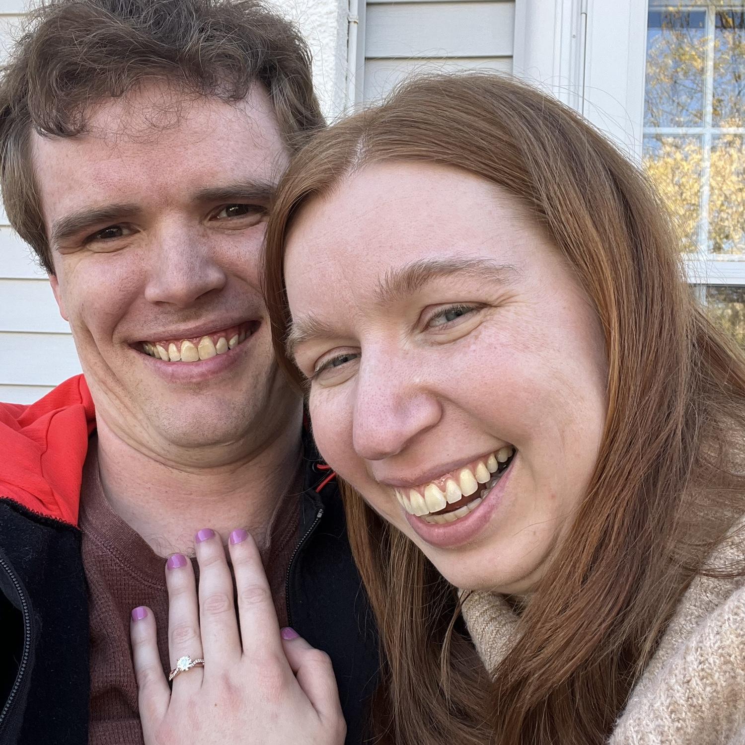 She said "yes" after he revealed heart-shaped rocks in the fire pit that said "will you marry me?"