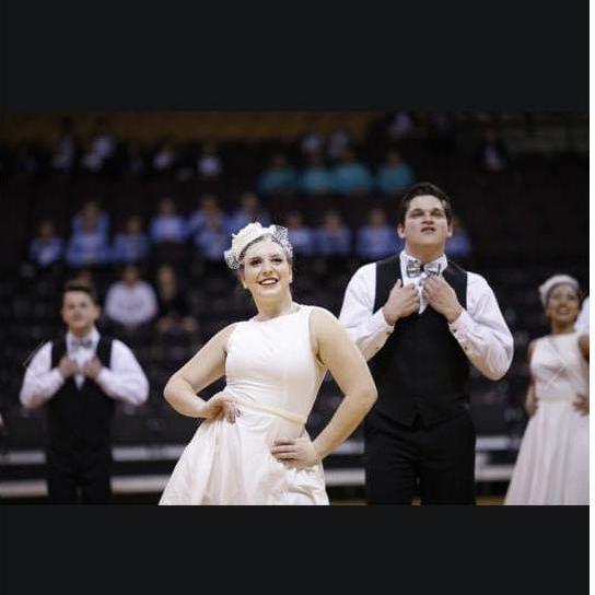 Dance Competition. This dance was actually a fox trot to "Ain't That a Kick In The Head", by dean martin. We had portrayed a bride a groom getting married!