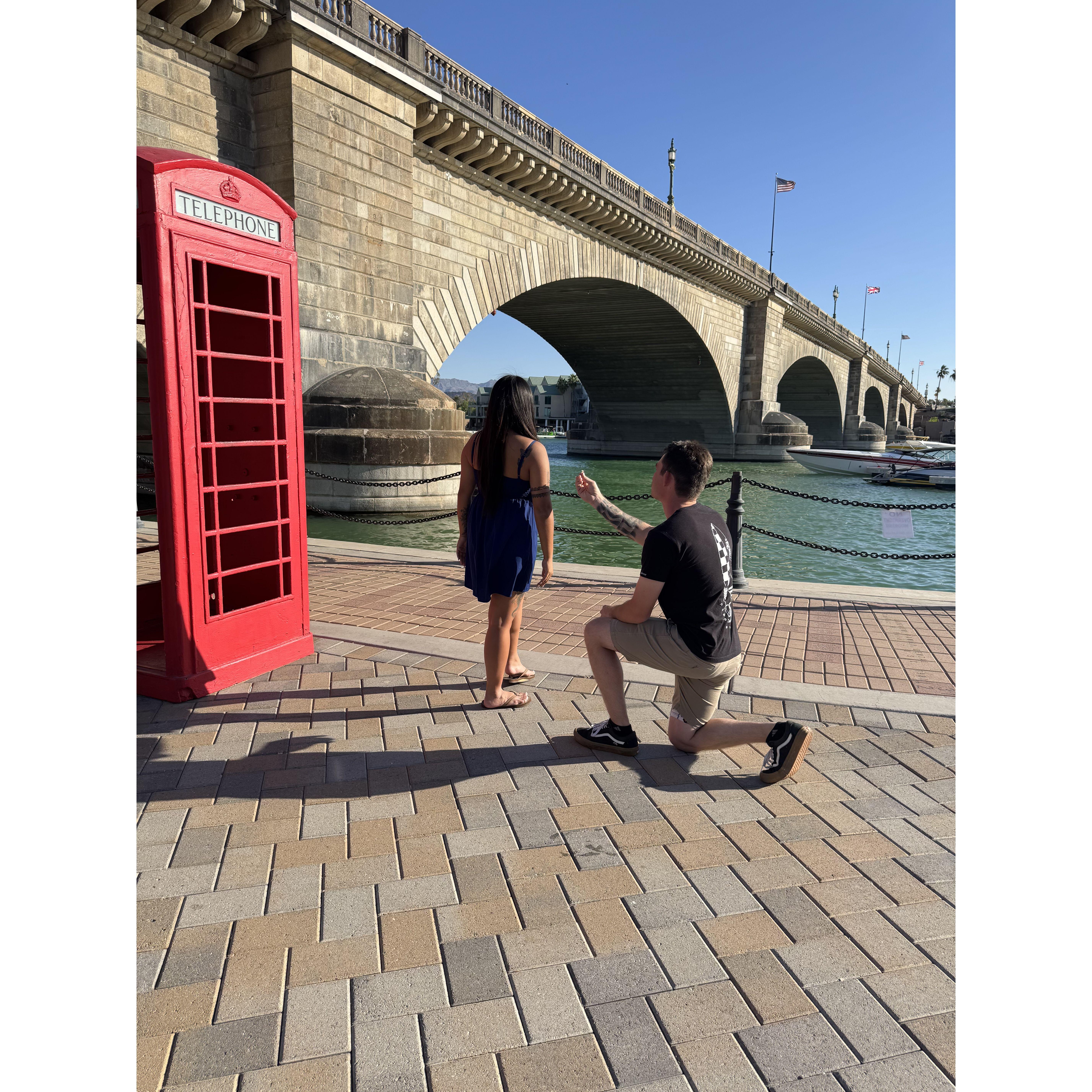 Ryan down on one knee and Darlyne not realizing it yet.