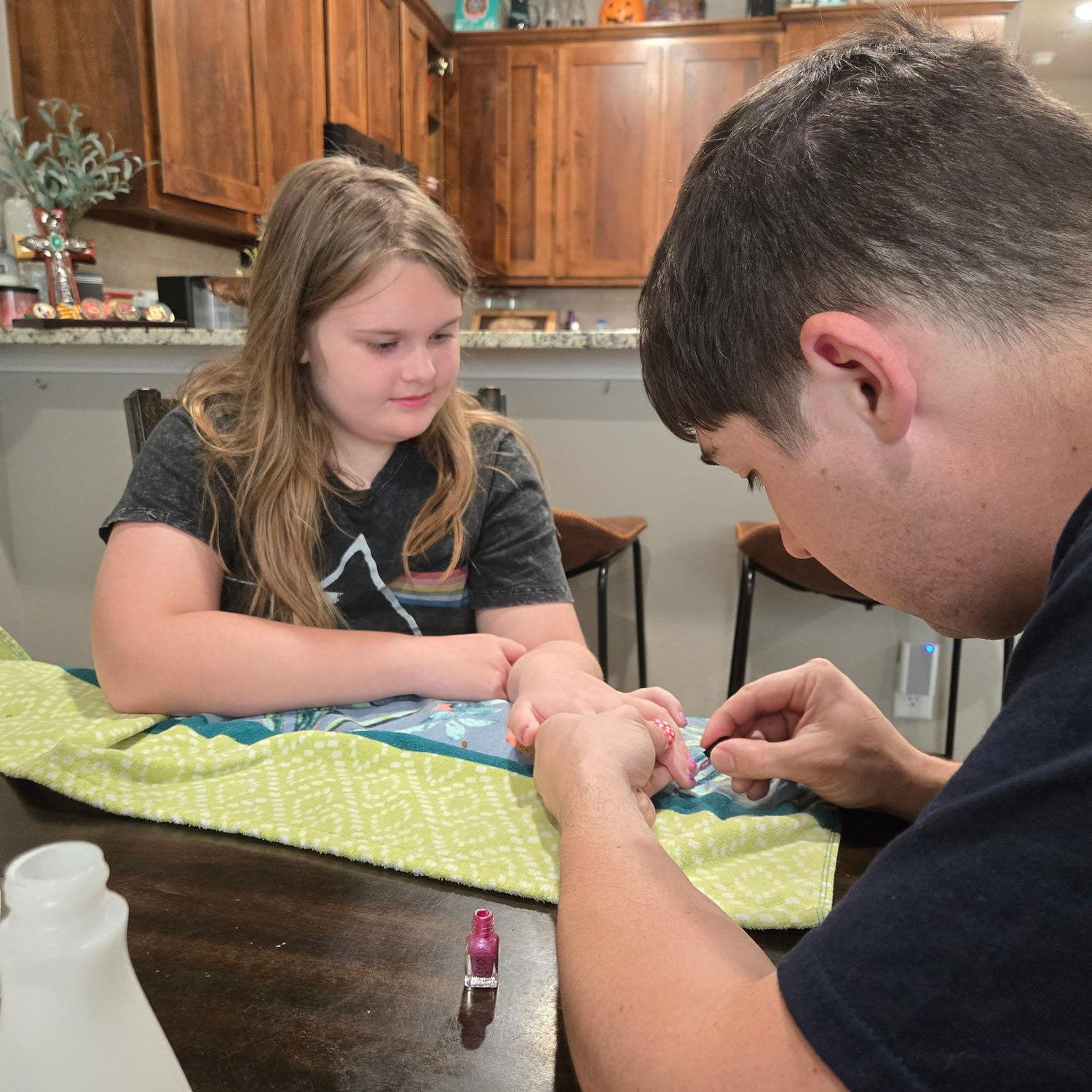Heidi getting her nails painted by the best nail painter in Texas!